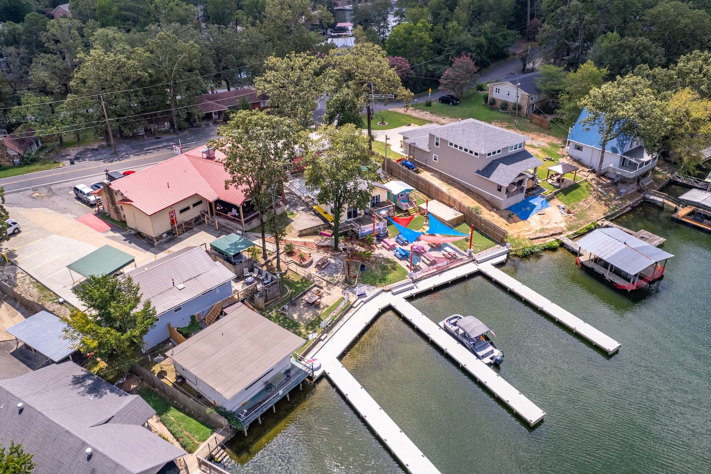 Aerial View of Sam's Pizza Pub in the Summertime!  This is a Locals Favorite and can be QUITE Busy with patrons coming by Boat and Land!  A Great Place to Catch some Live Music on most Weekends!