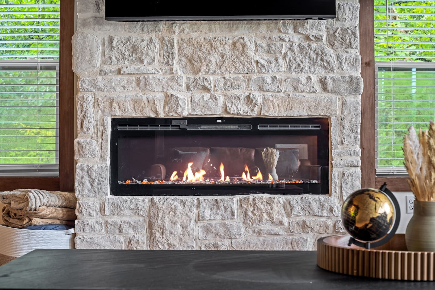 cozy living room fireplace with remote control 