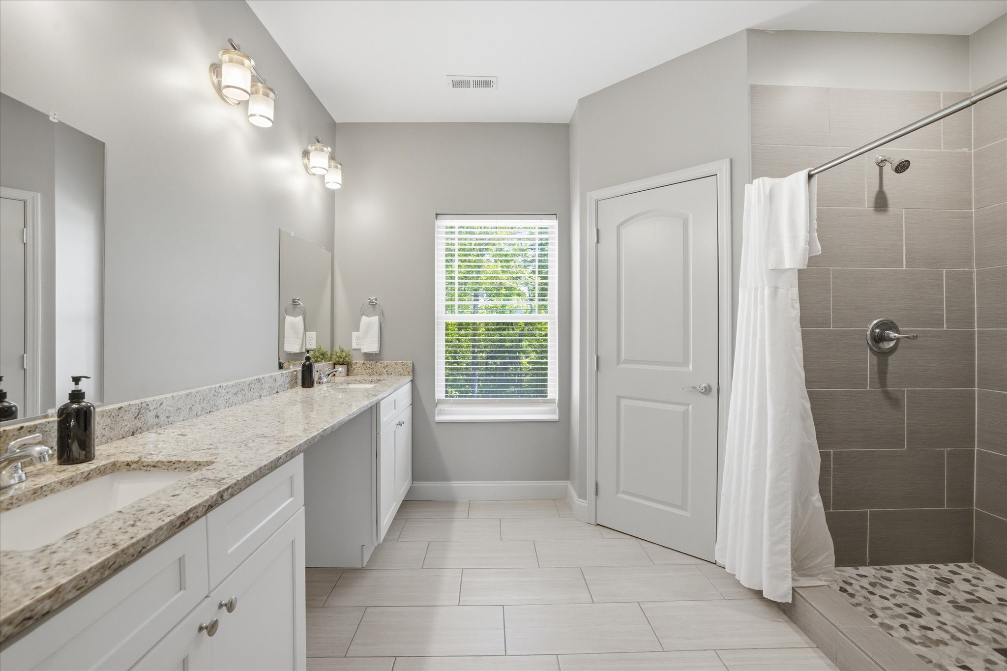 Everything comes together here—double sinks, a full shower, and a layout in Unit 4 that gives you space to get ready without working around anyone else.