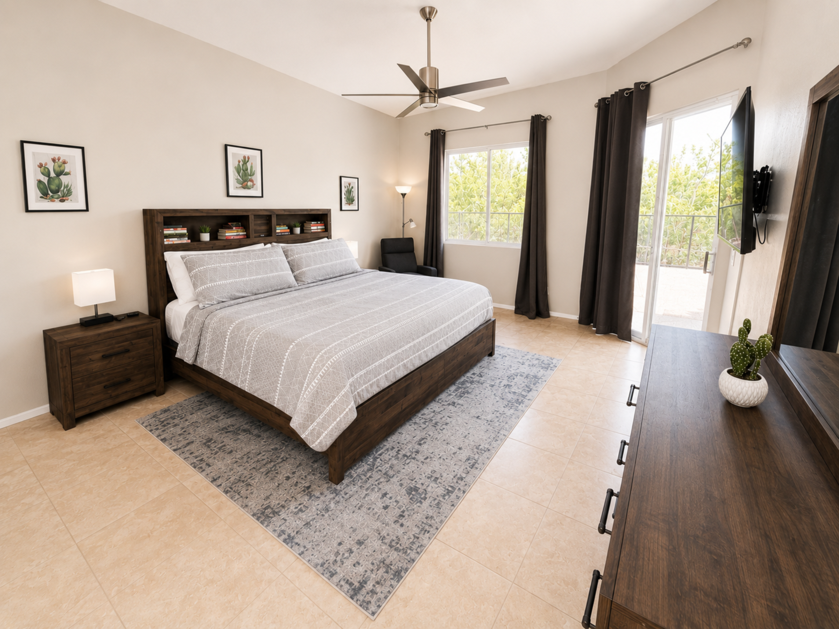 You'll sleep great in the spacious primary bedroom. King size bed, 2 nightstands, dresser and a recliner. Walk right out the sliding doors to the backyard and pool.