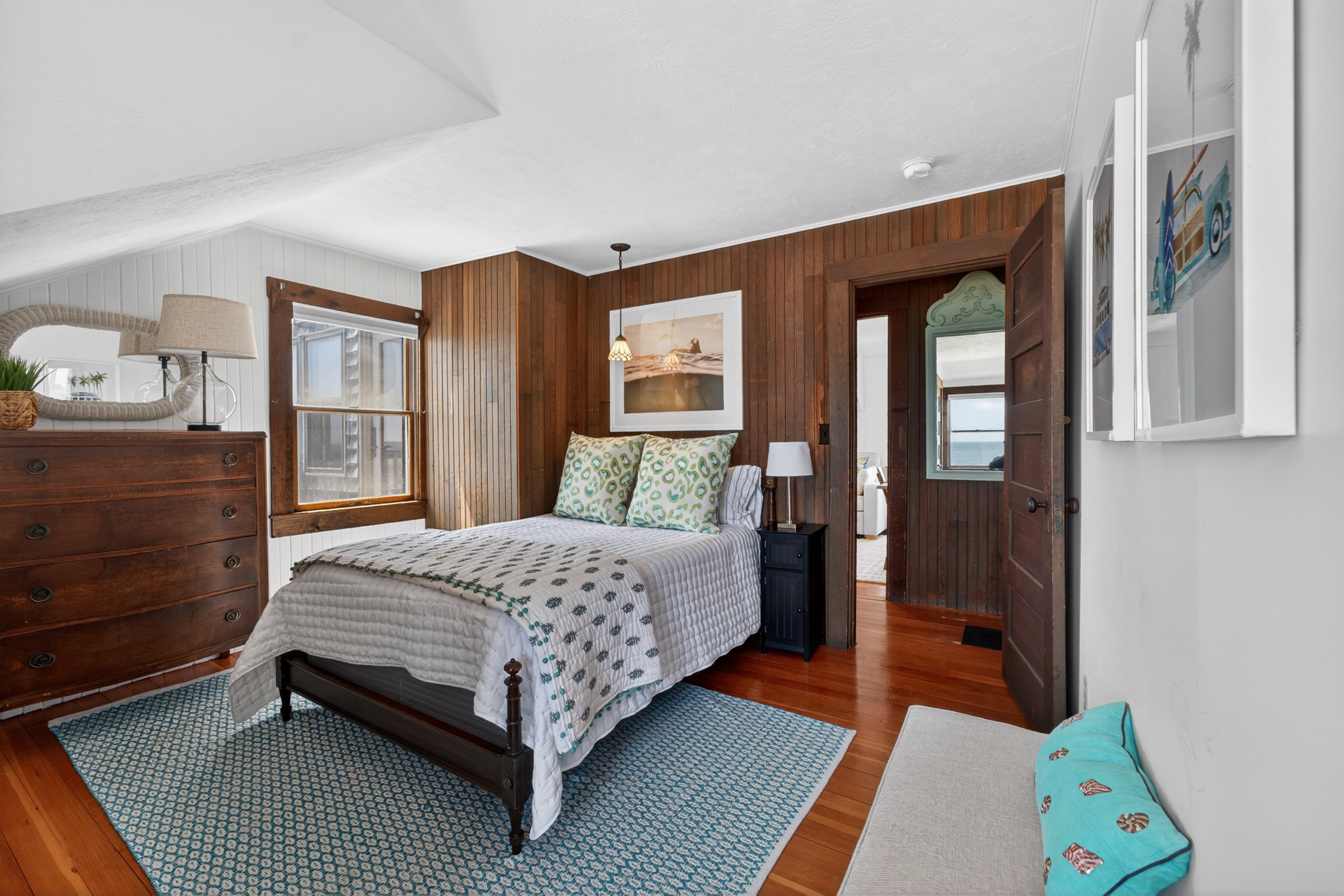 Welcome to our second bedroom! 
Relax in this charming oceanfront bedroom with a cozy full bed and water views!