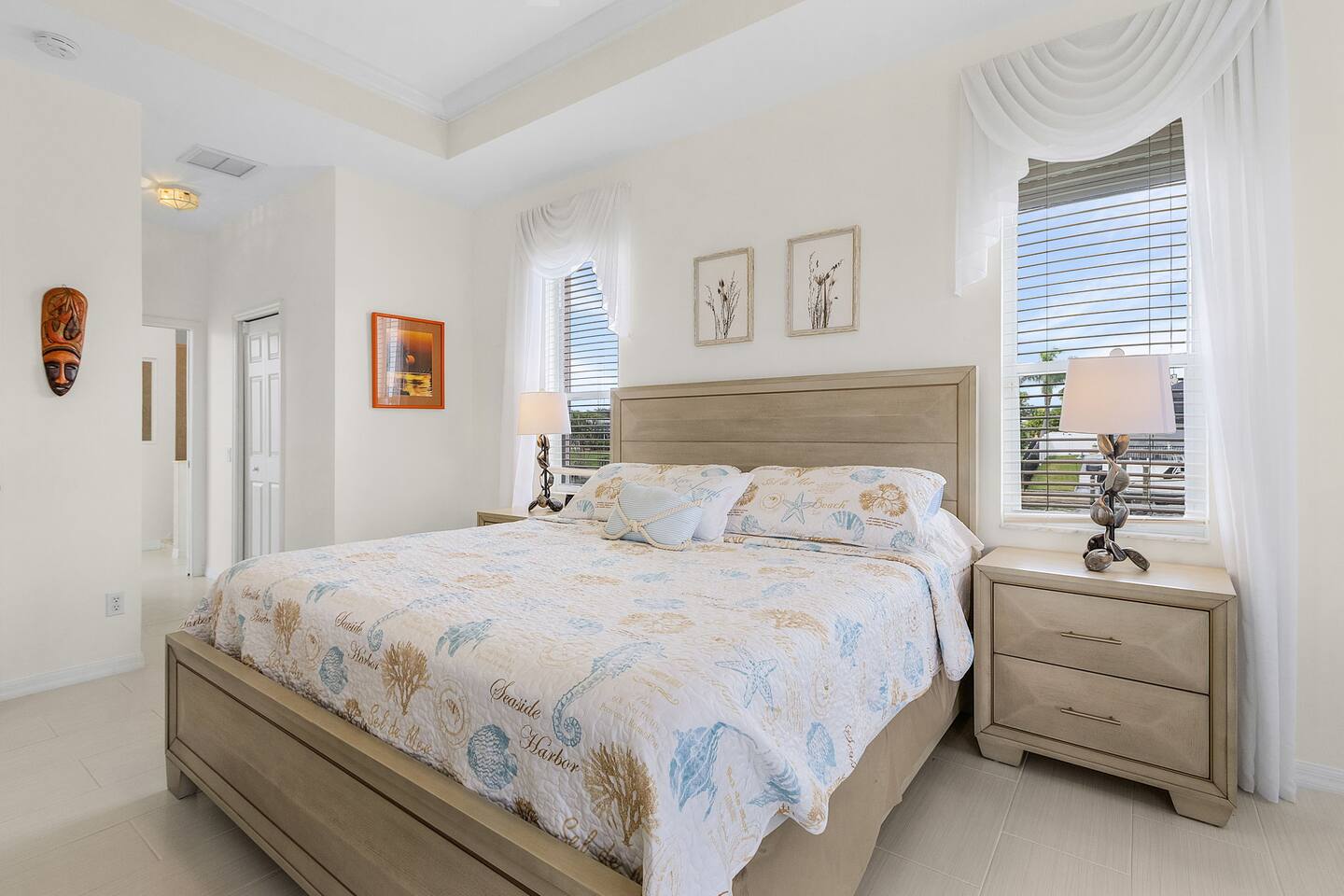 Unwind in the primary bedroom with plush bedding for restful nights and serene relaxation!