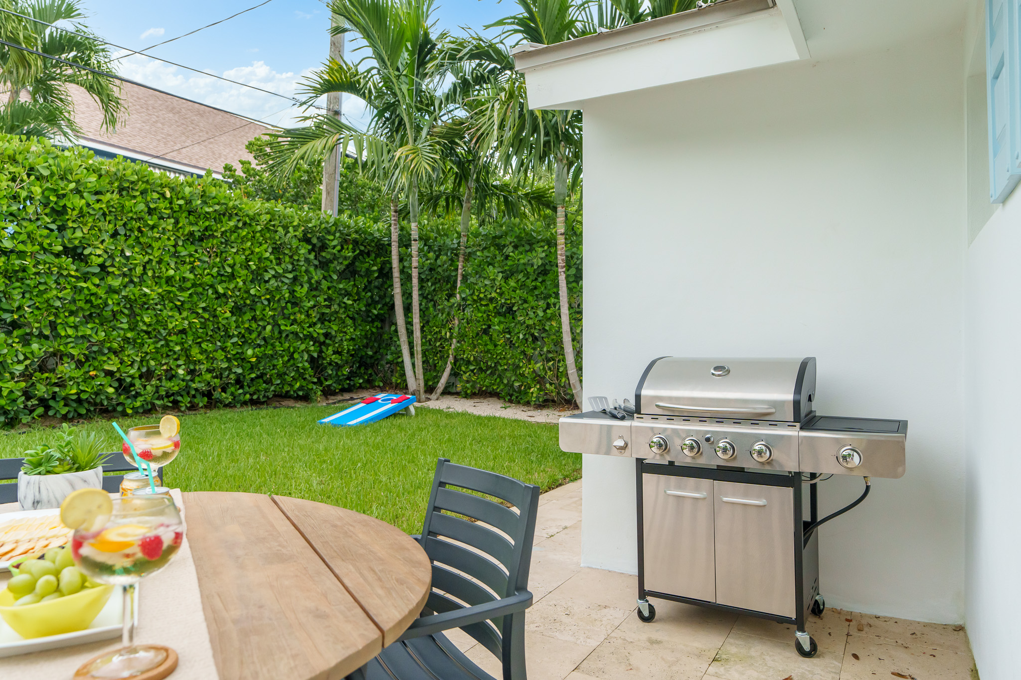 Outdoor dining, propane grill, cornhole