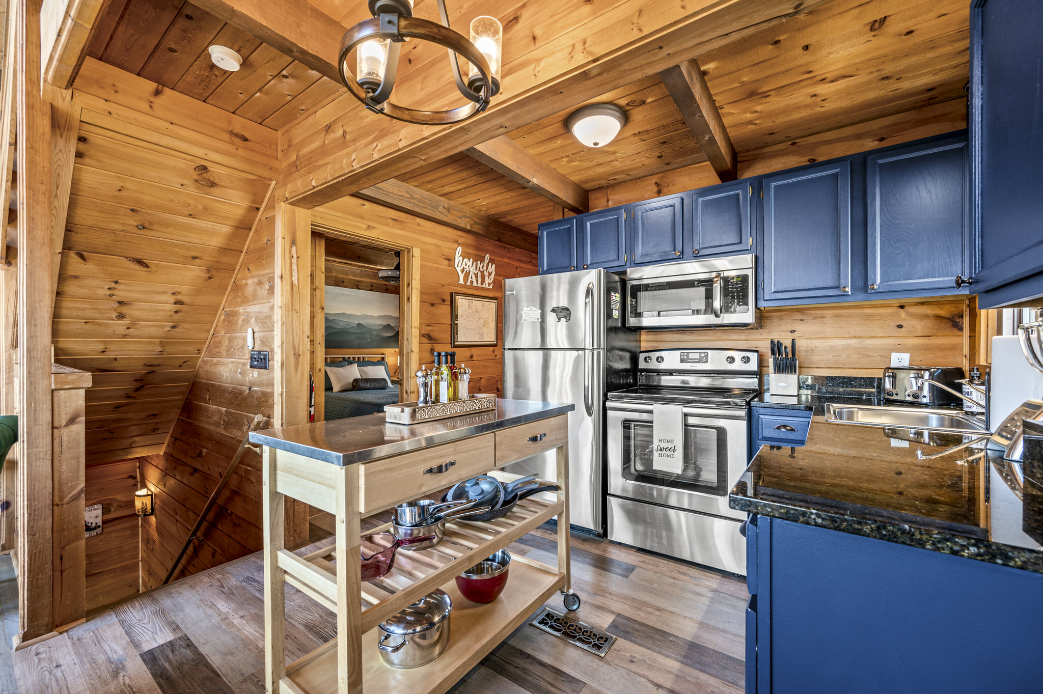 The kitchen is quaint, but fully stocked and ready for any meal to be cooked.  Park style grill out front is a hit as well!
