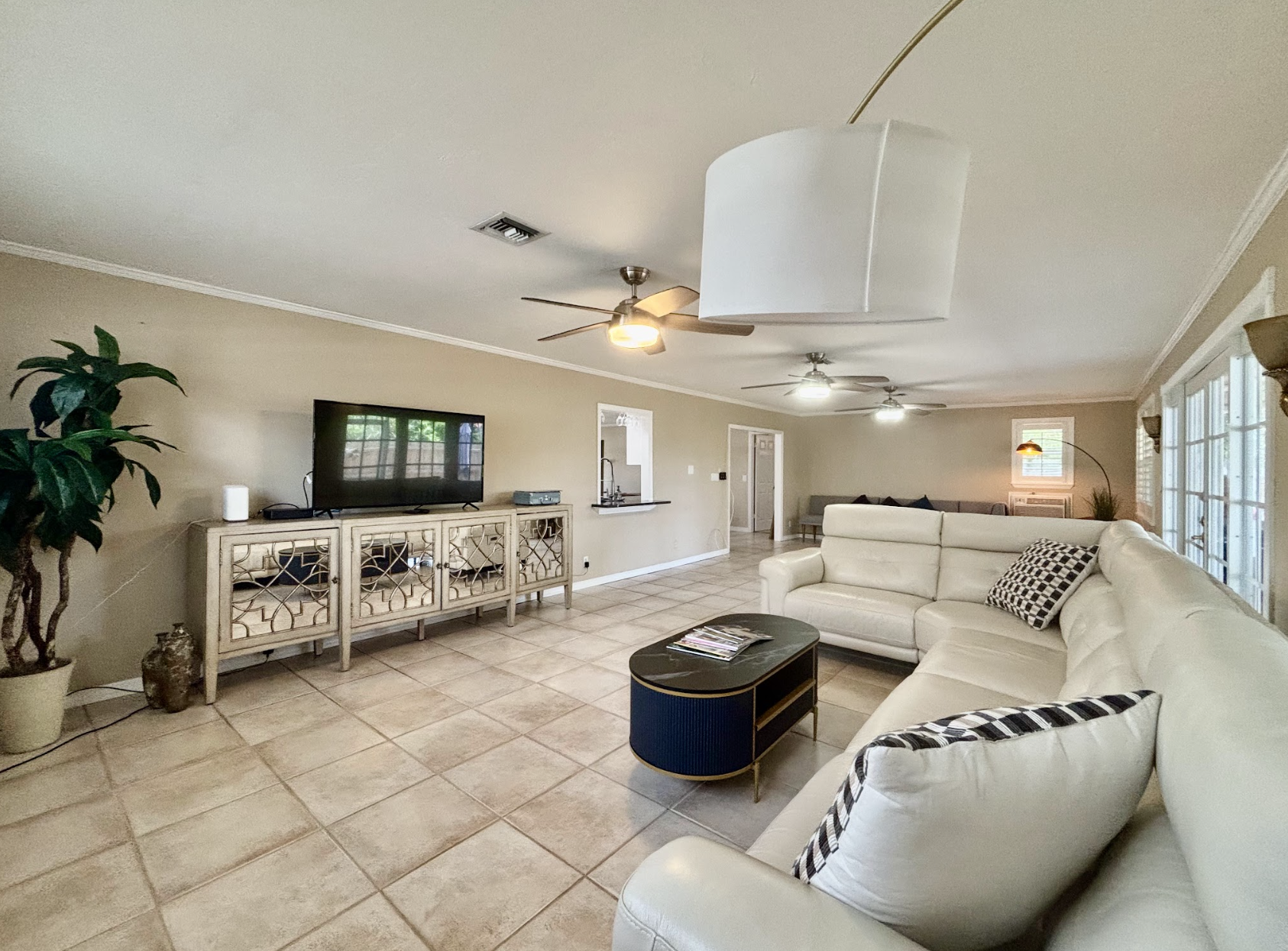 Our expansive rear living room has an abundance of seating and cozy nooks, as well as a comfortable couch with recliners.