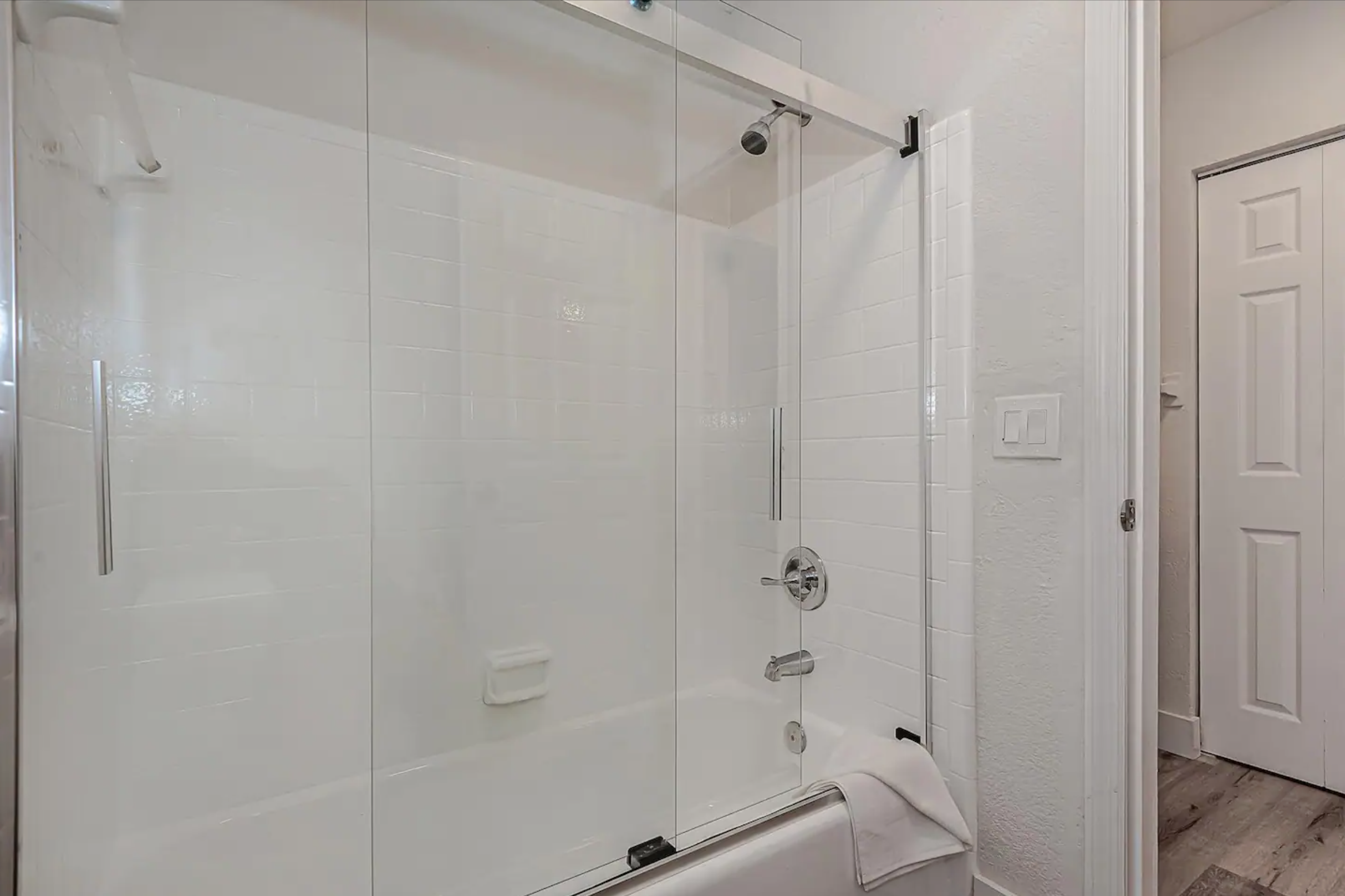 Bathrooms stocked with basic bath products, including body soap, shampoo, and conditioner.
