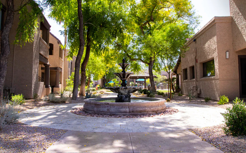 Community exterior with landscaped walkways and desert-style grounds.