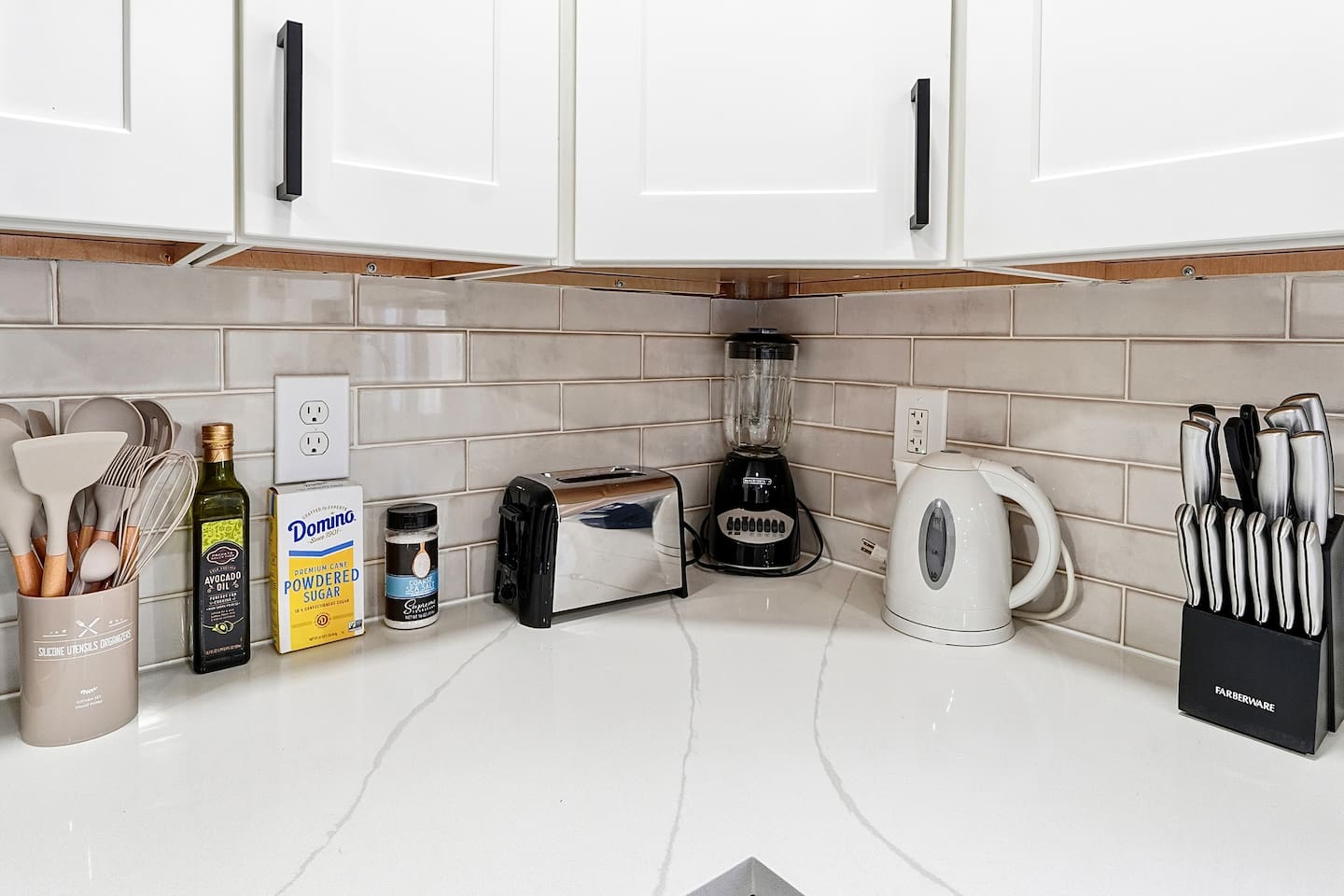 Bright white kitchen with a sleek, extended layout and ample counter space. The long layout offers plenty of countertop space, perfect for cooking, prepping, and everyday meals. Fully stocked with everything you need for a comfortable stay!
