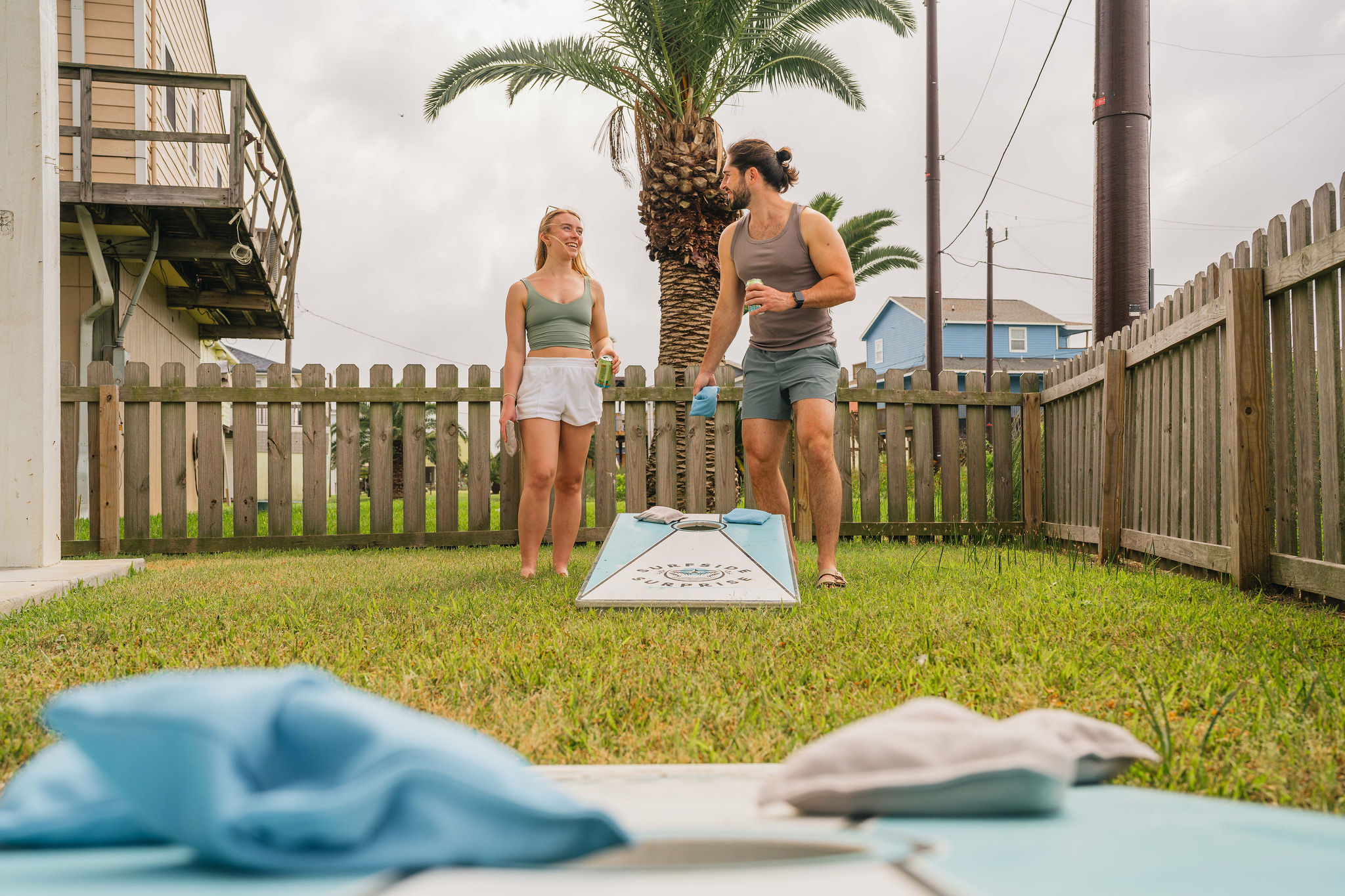 Cornhole in the fenced yard — kids safe, adults competitive, beers optional (encouraged).
