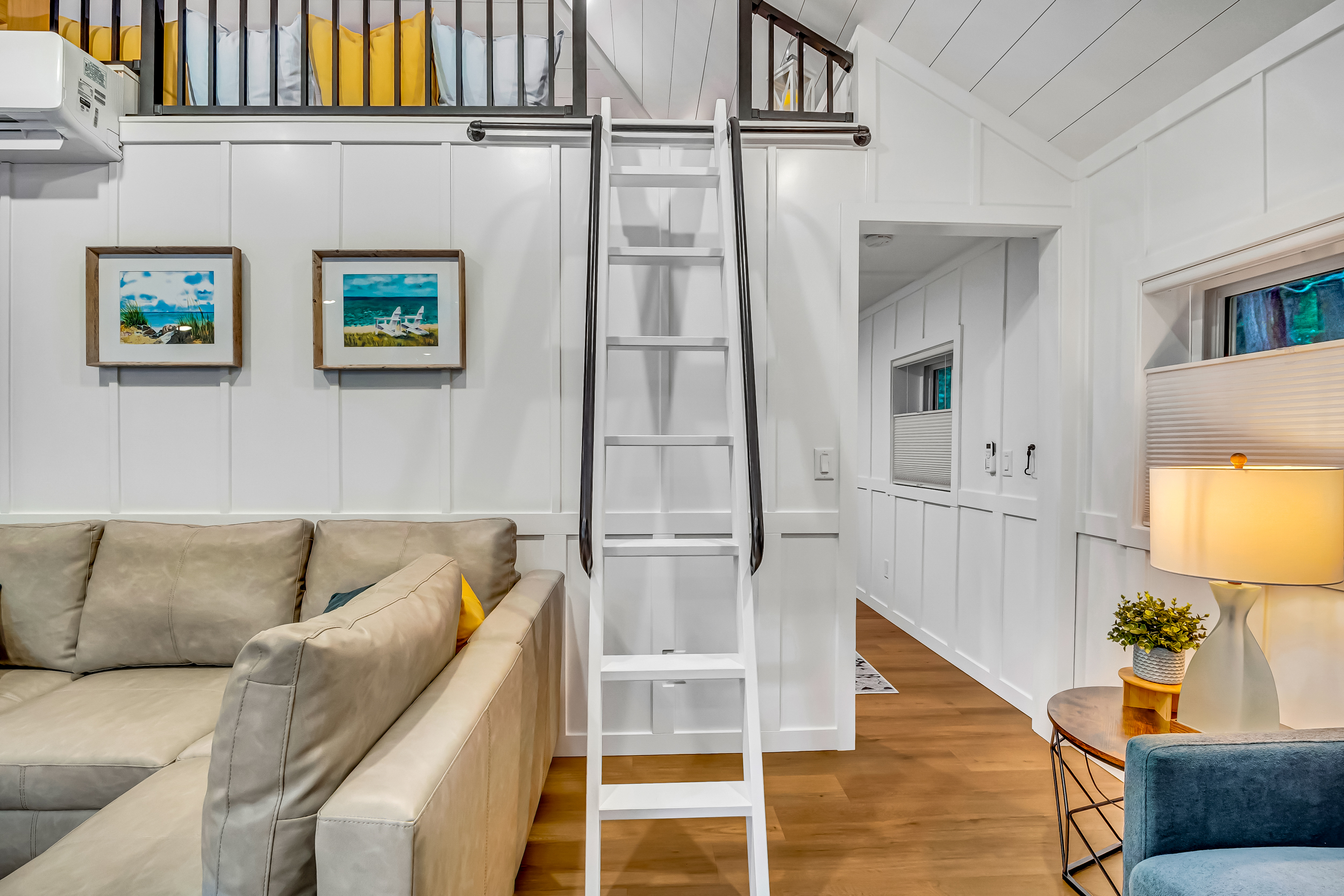 Loft is only accessible by ladder. It can be pushed up against the wall when not in use. 