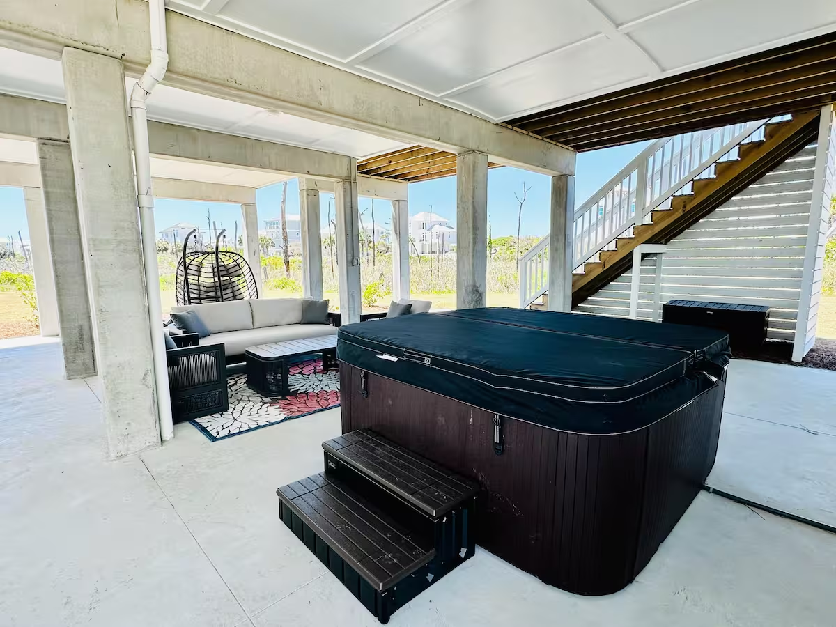 Unwind in the brand-new hot tub for your perfect coastal getaway.