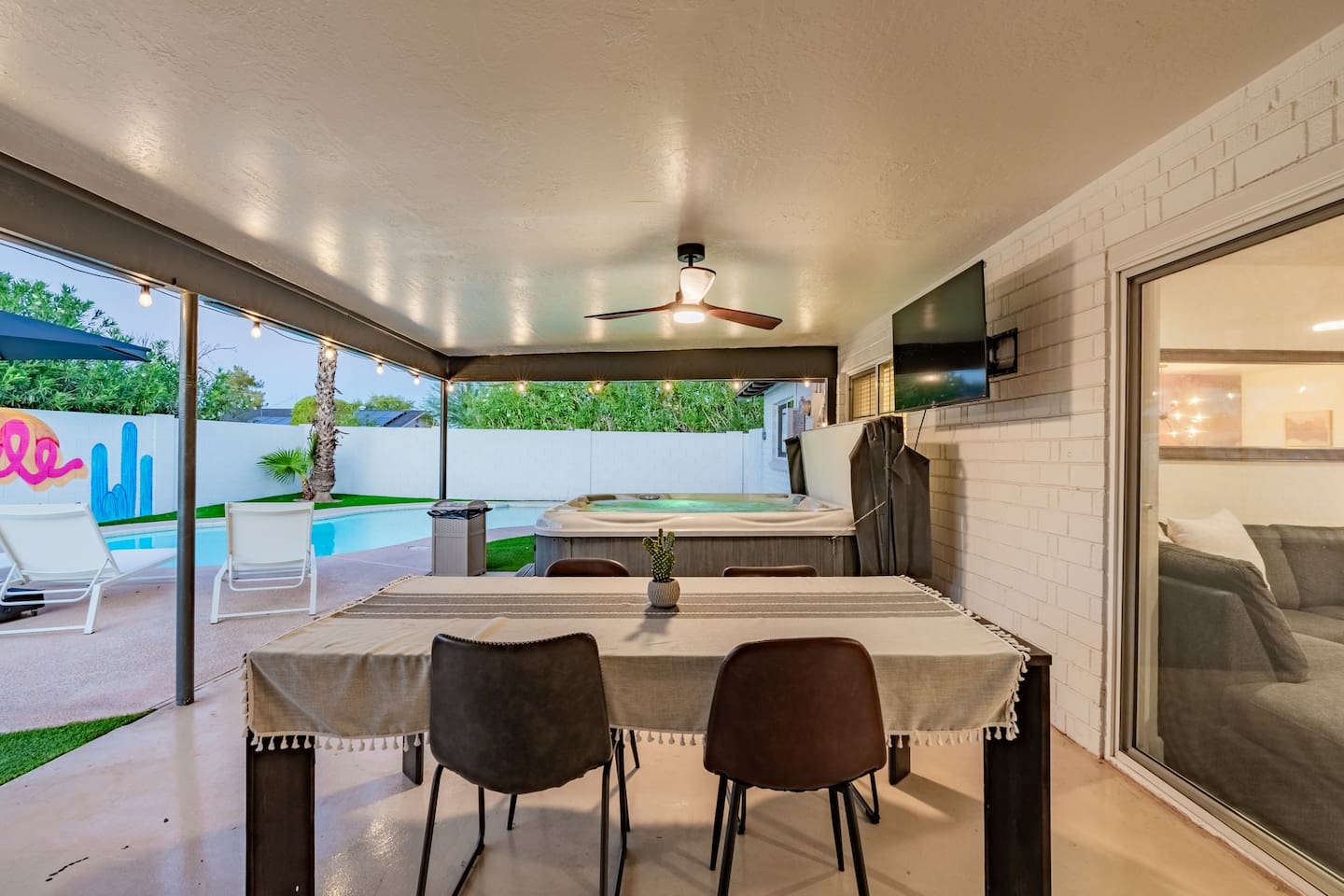 Relax in the hot tub just steps away from the outdoor dining table—ideal for evenings after a long day of exploring.

