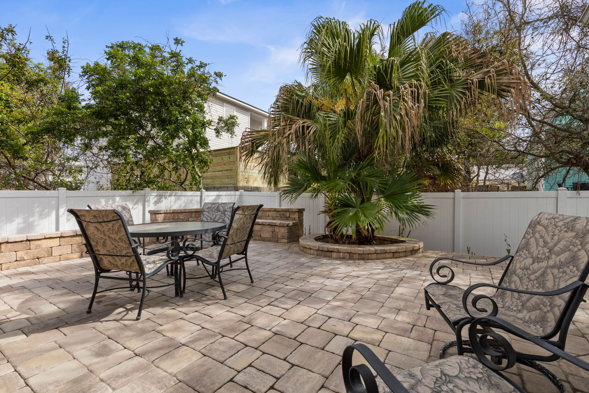 Sip coffee beneath the palms, gather for dinner on the sunny patio, and let the day slow down between beach adventures—this private outdoor space is made for easy conversation, warm breezes, and lingering vacation moments.
