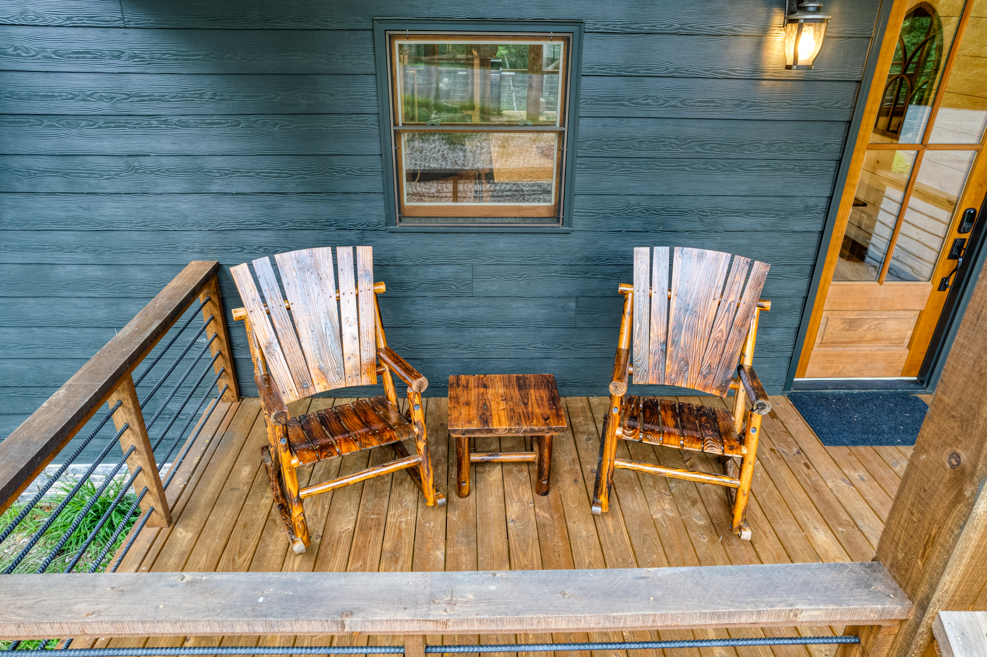 Front porch seating includes two rocking chairs.