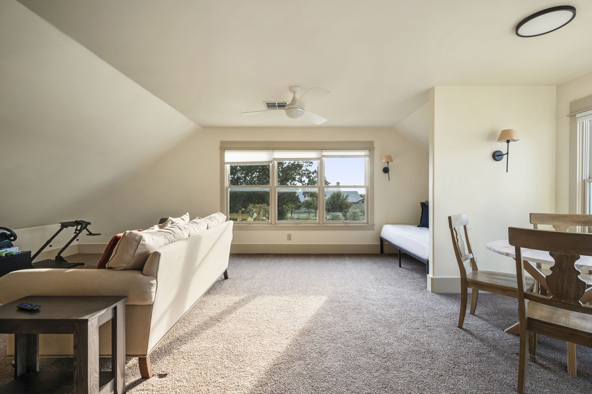 Large windows fill the space with natural light, creating a bright and inviting retreat.