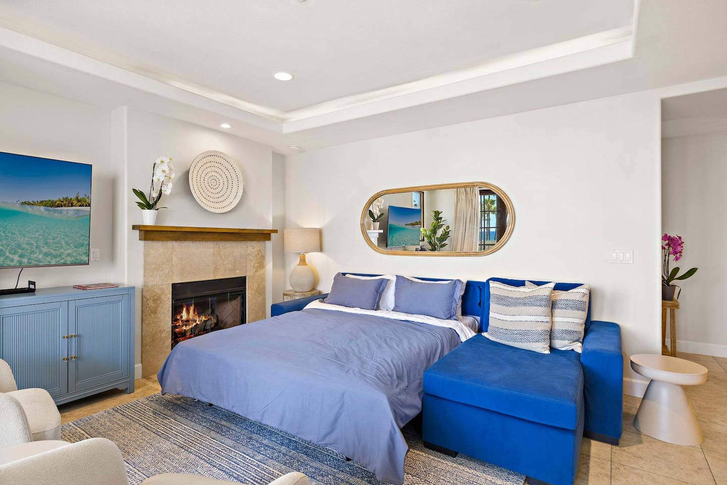 Here is the queen-sized sofa bed extended and setup for sleeping.  Some people prefer sleeping out here so they can hear waves at night.