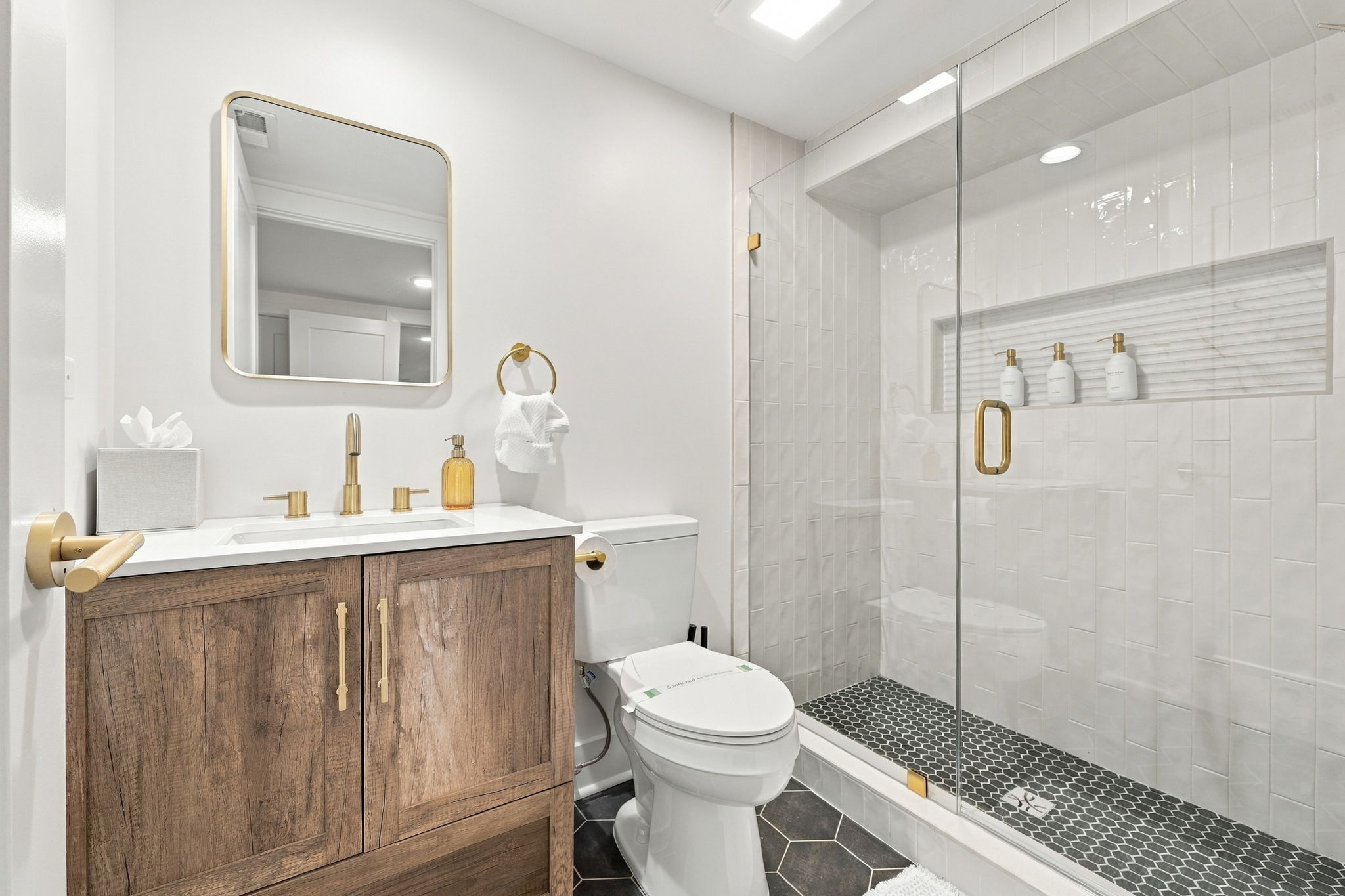 Bathroom Bliss: Elegant finishes, sleek shower, and modern decor for your refreshing retreat!