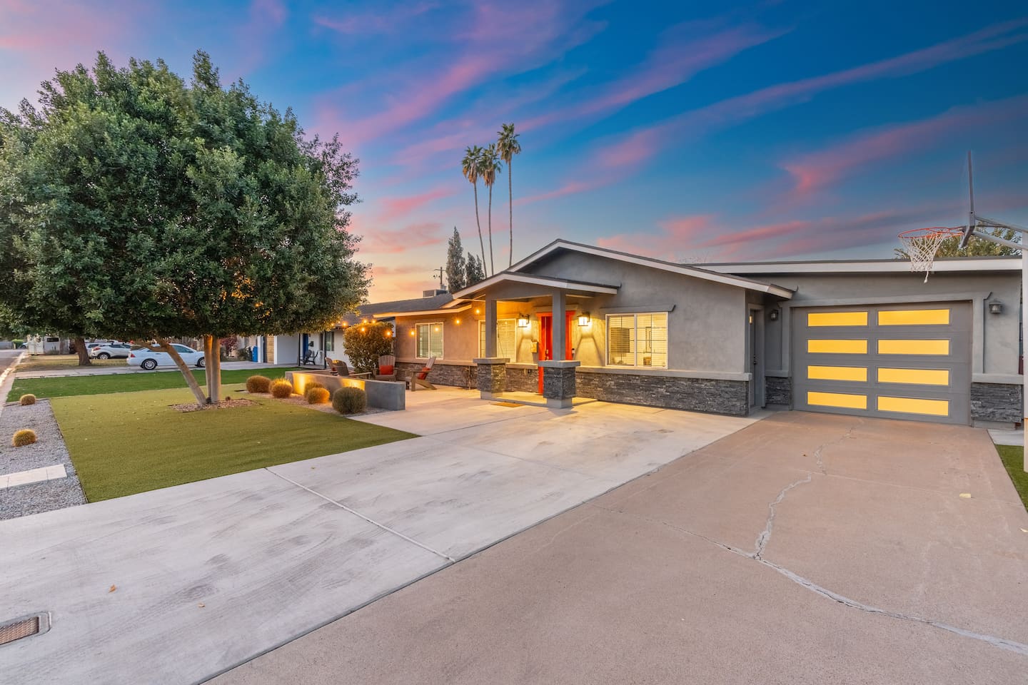The house at night, beautifully illuminated with warm lighting, creating a welcoming and serene atmosphere.
