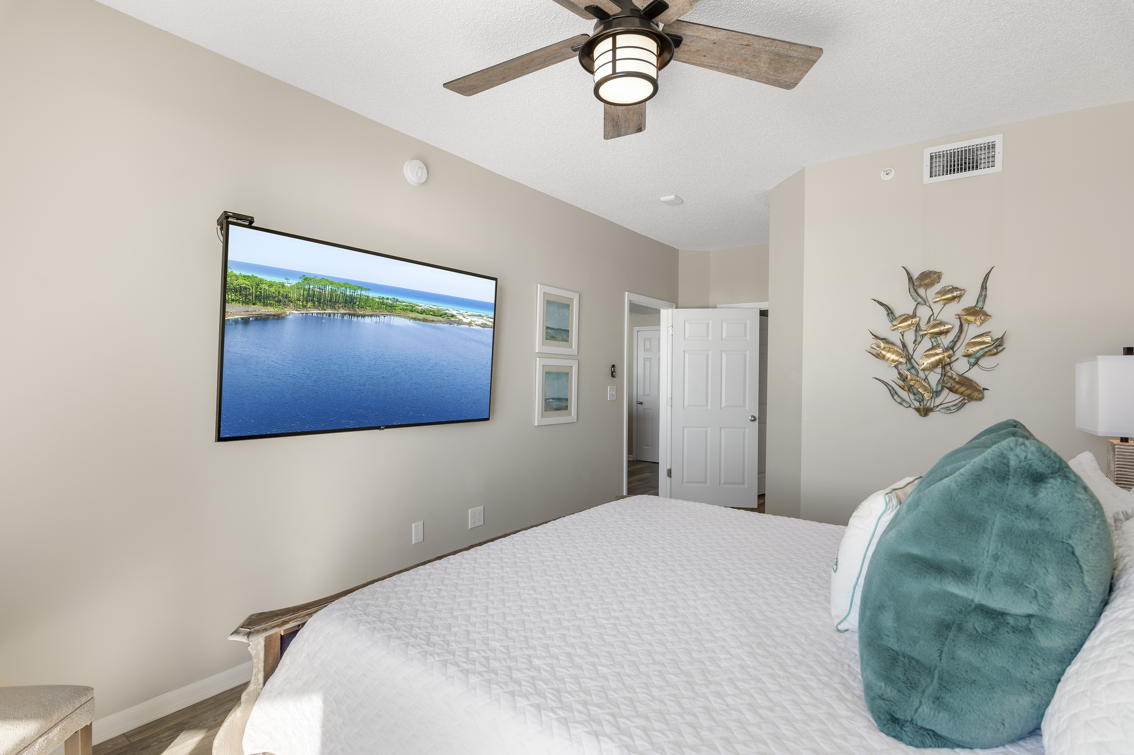 Big Gulf views from the primary bedroom which features a King Bed, new furniture, HUGE 70" Smart TV, large closet, and private bathroom with dual vanity & new countertops