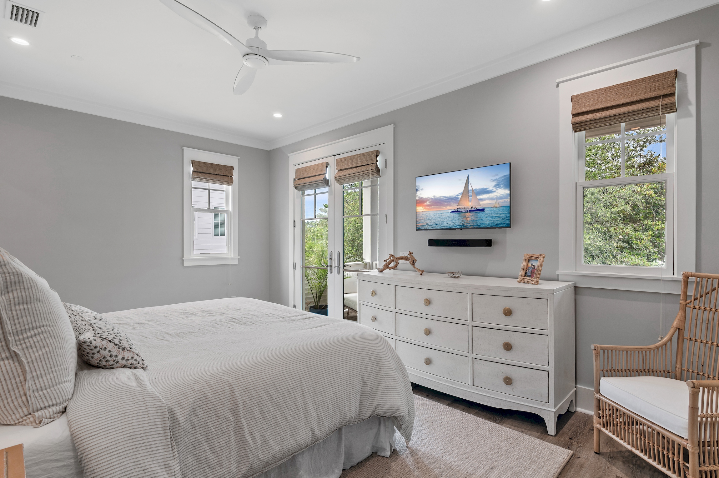 A large dresser and wall mounted TV make it feel like home.