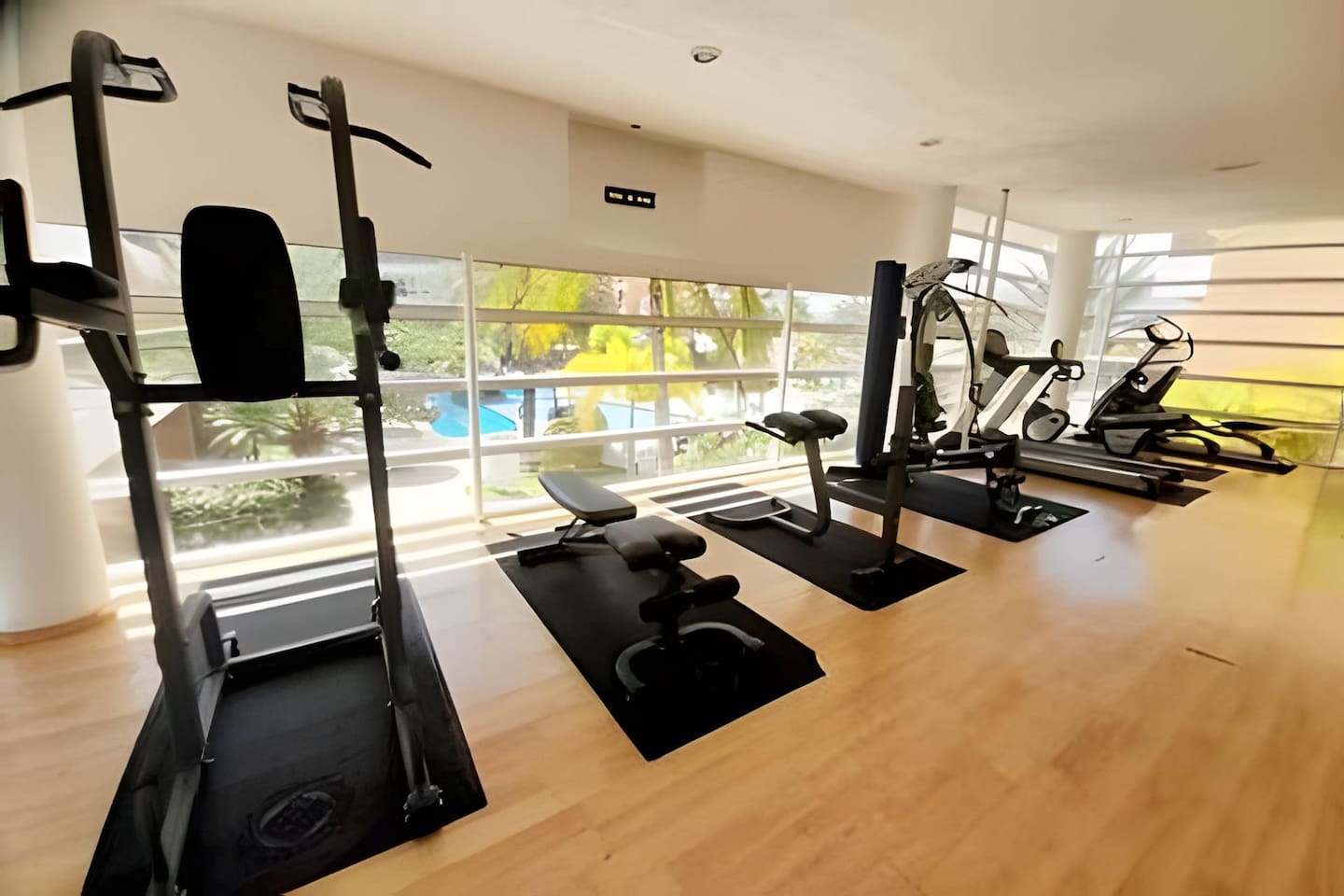A spacious gym with a variety of equipment to keep your workout routine on track.
