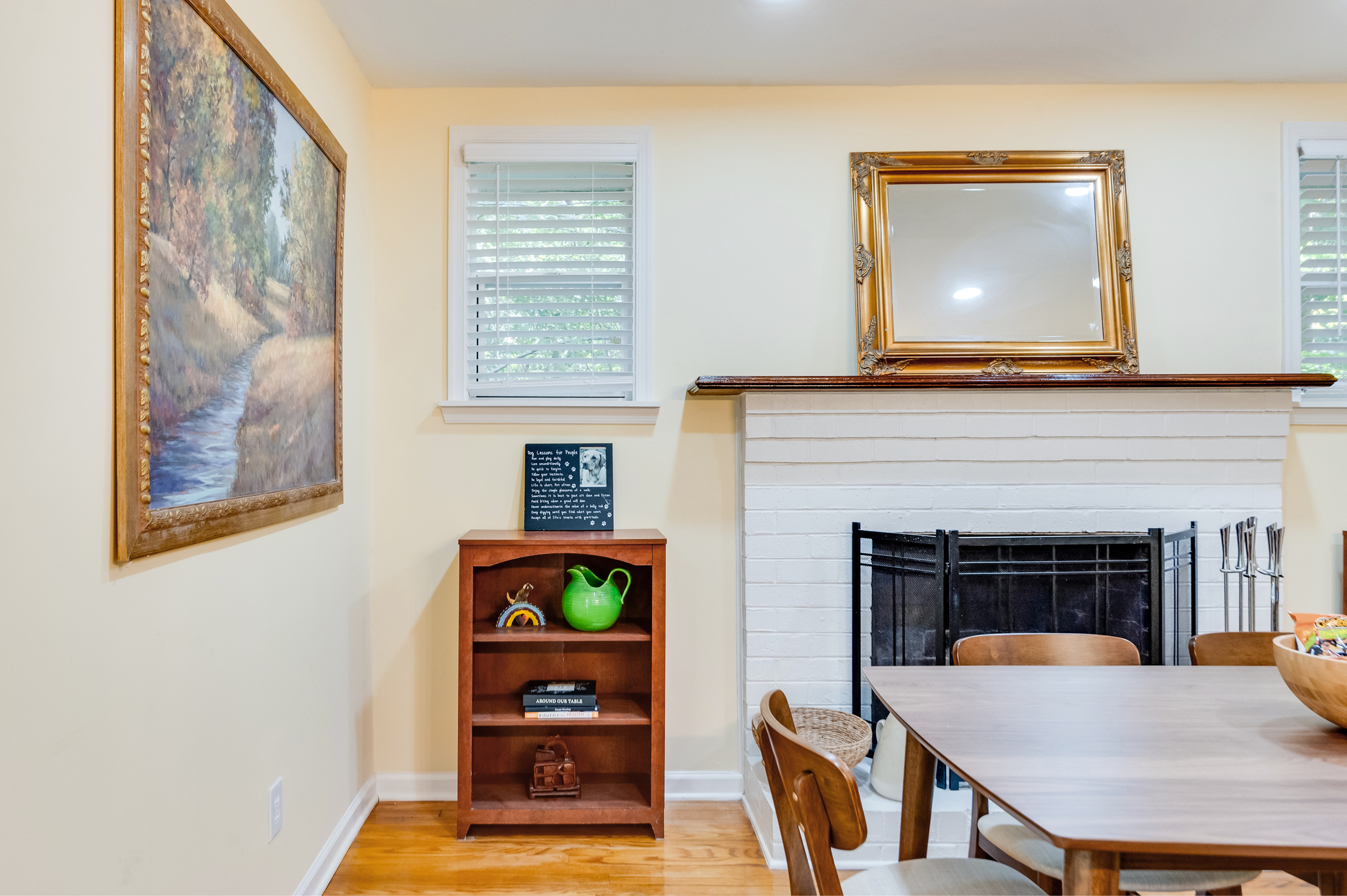 Dining Area: Bright and inviting space with artful decor and a lovely view for memorable meals!