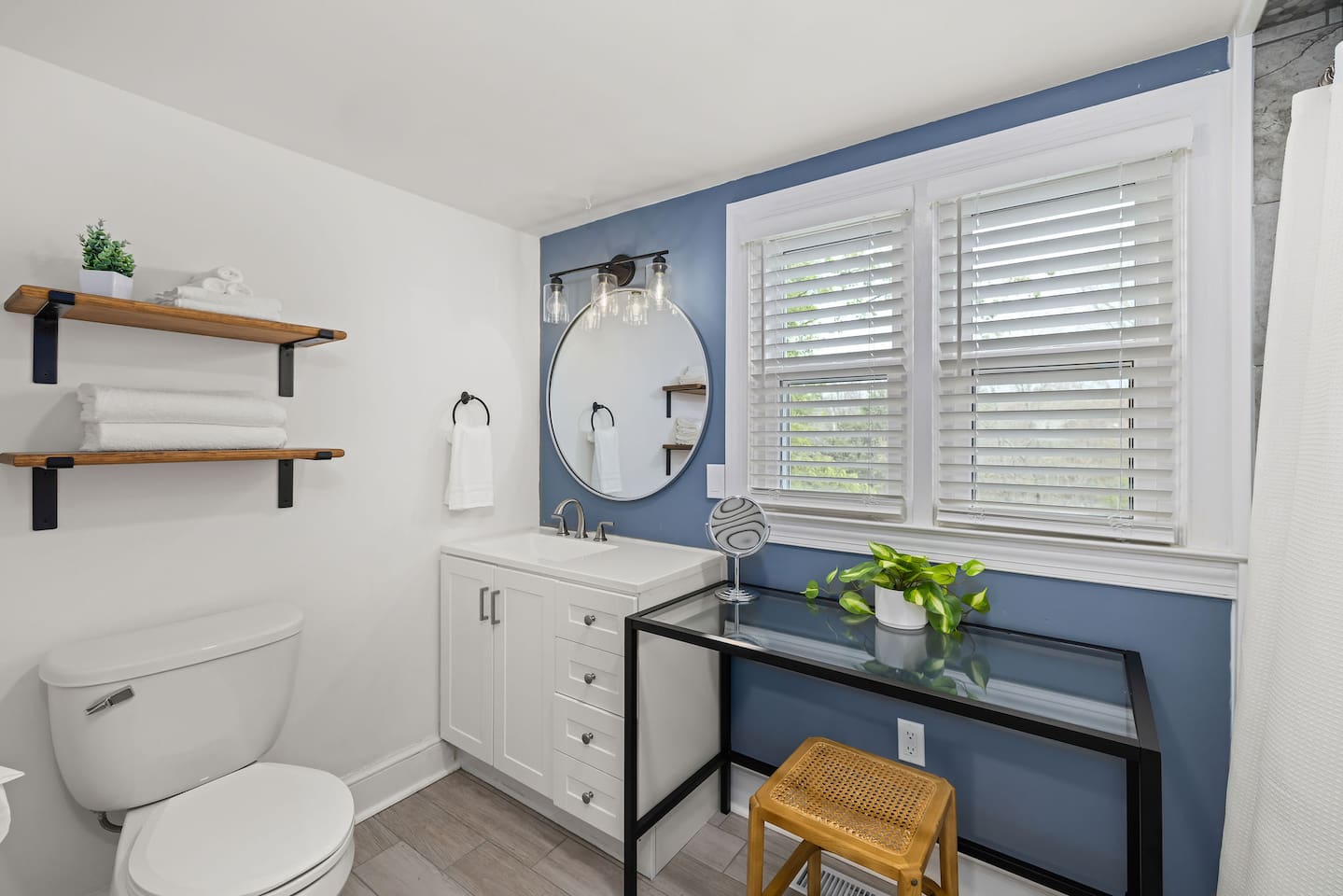 Magnolia Suite full bathroom includes a sink, toilet, tile shower, and seated vanity.