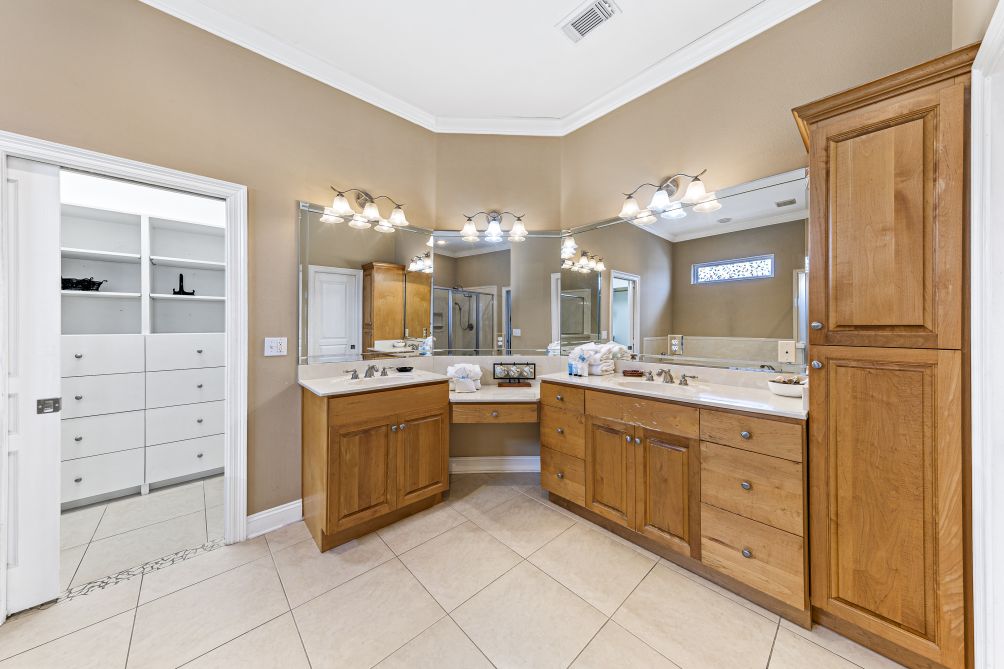 Spacious bathroom with dual vanities and built-in storage