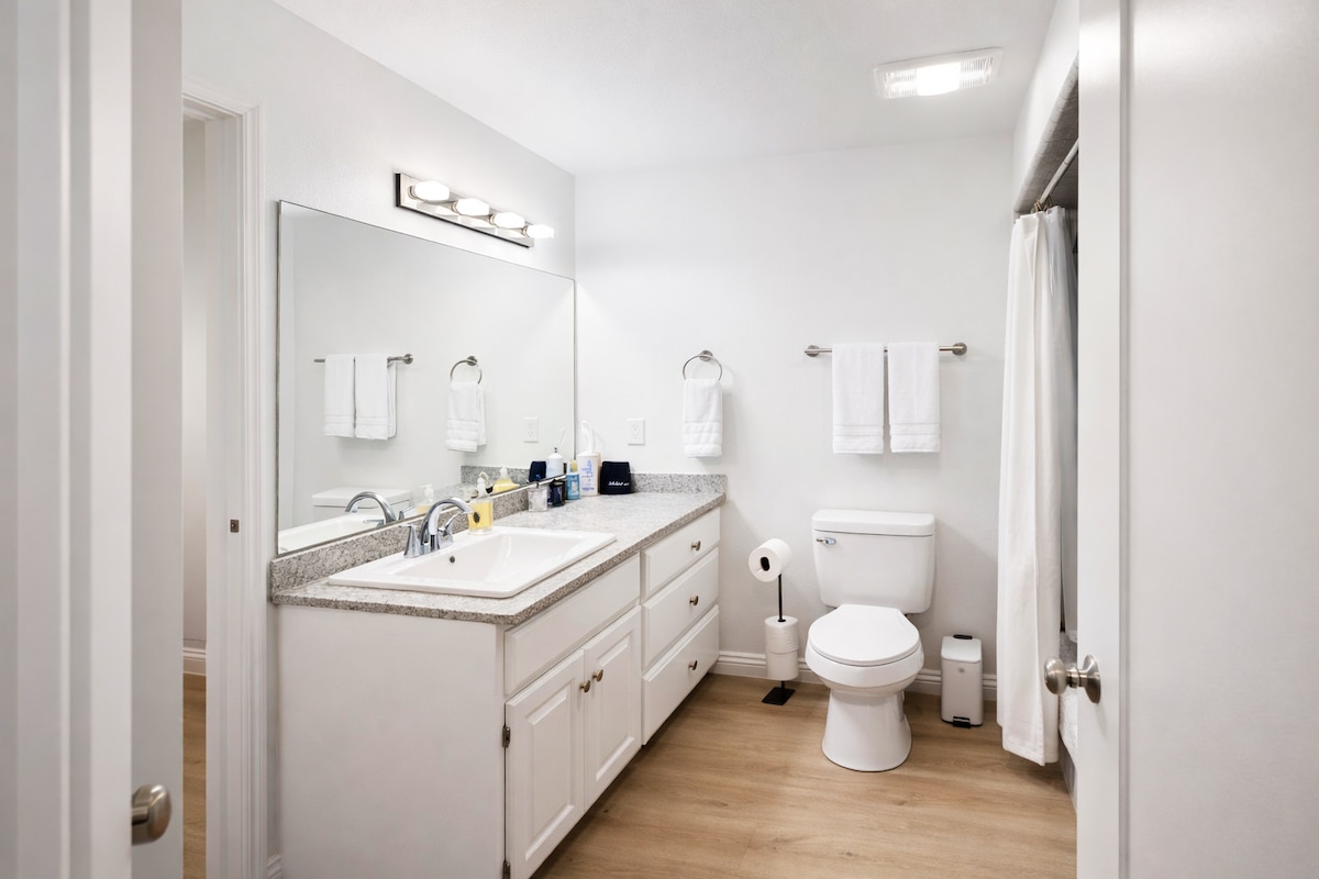 A clean, bright bathroom vanity — stocked and ready for your stay.