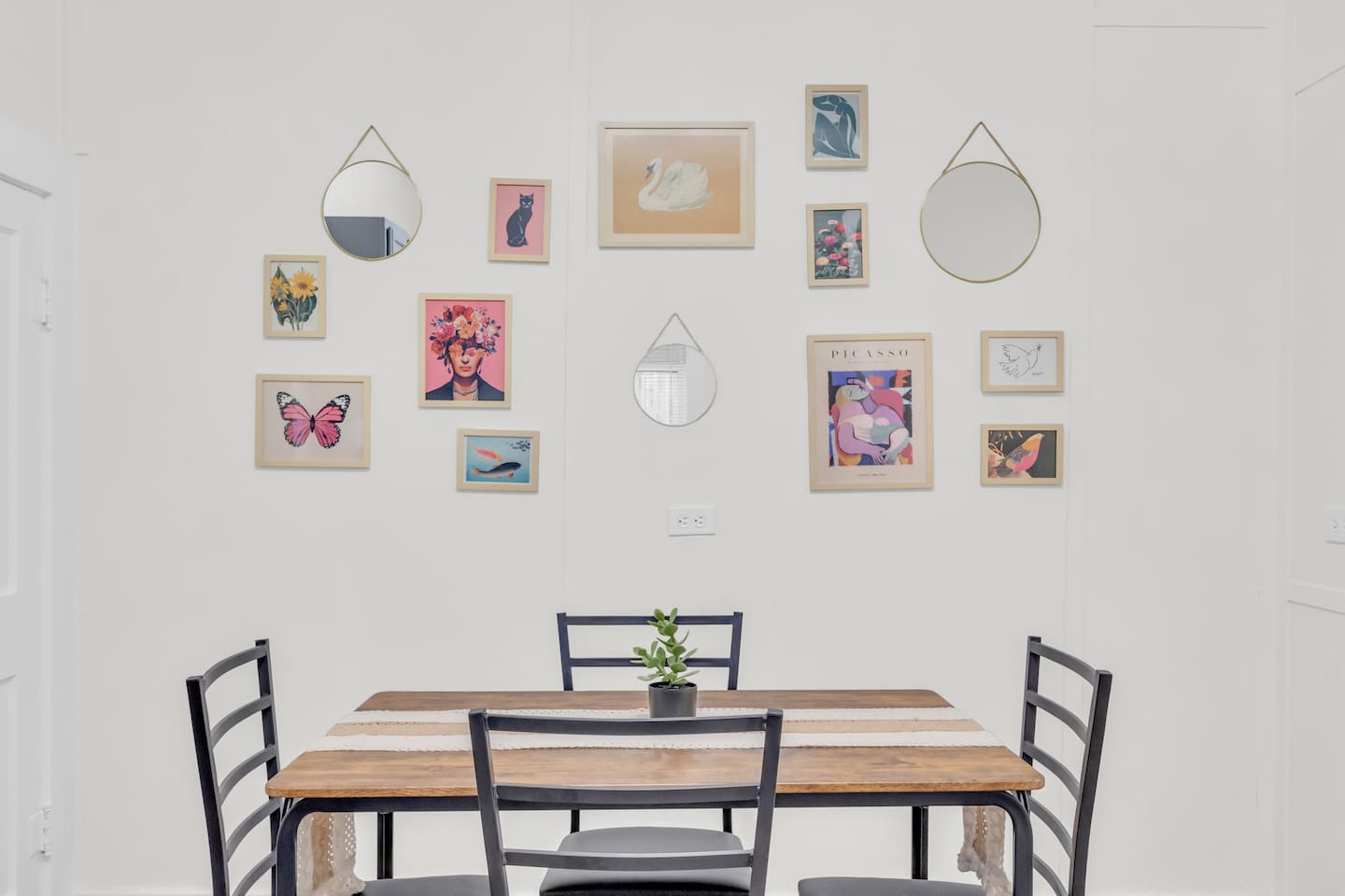 Eat-in kitchen with dining table and bright natural light.