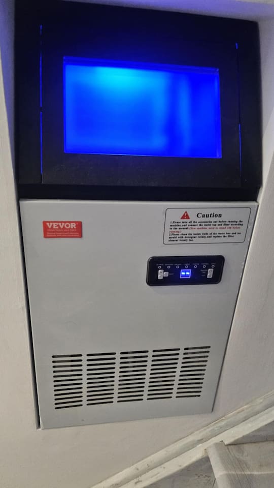 The Ice machine is located at the bottom of the stairs and is connected to the reverse osmosis water filter. Press the power button to start making ice, press and hold the power button to turn it off when you are done.  This is not a freezer.