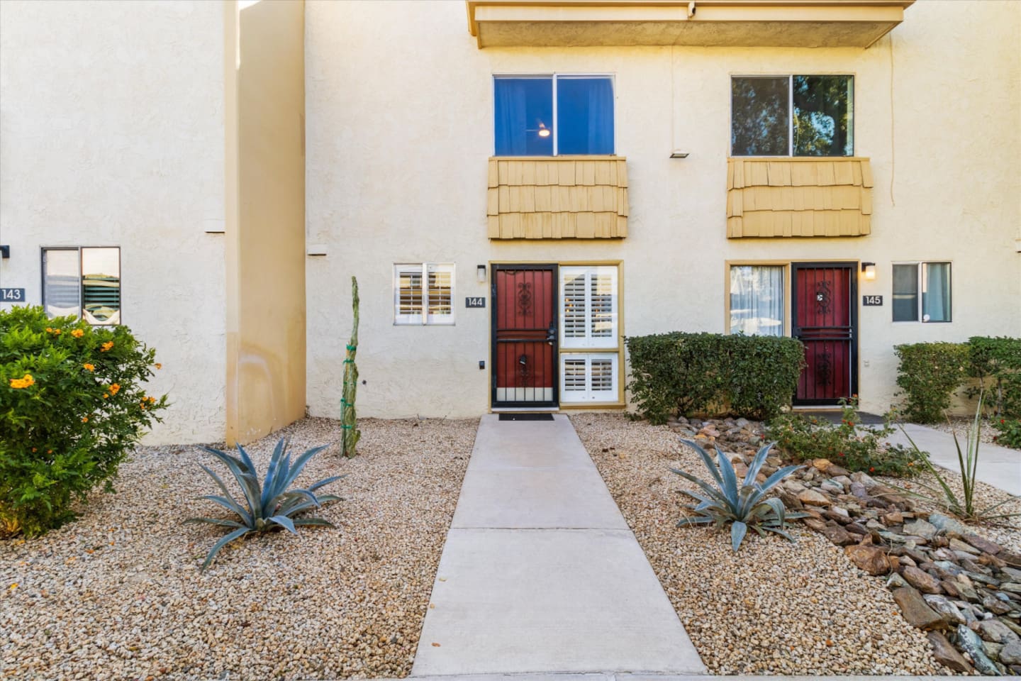 Exterior View with desert landscaping and easy front-door access.
