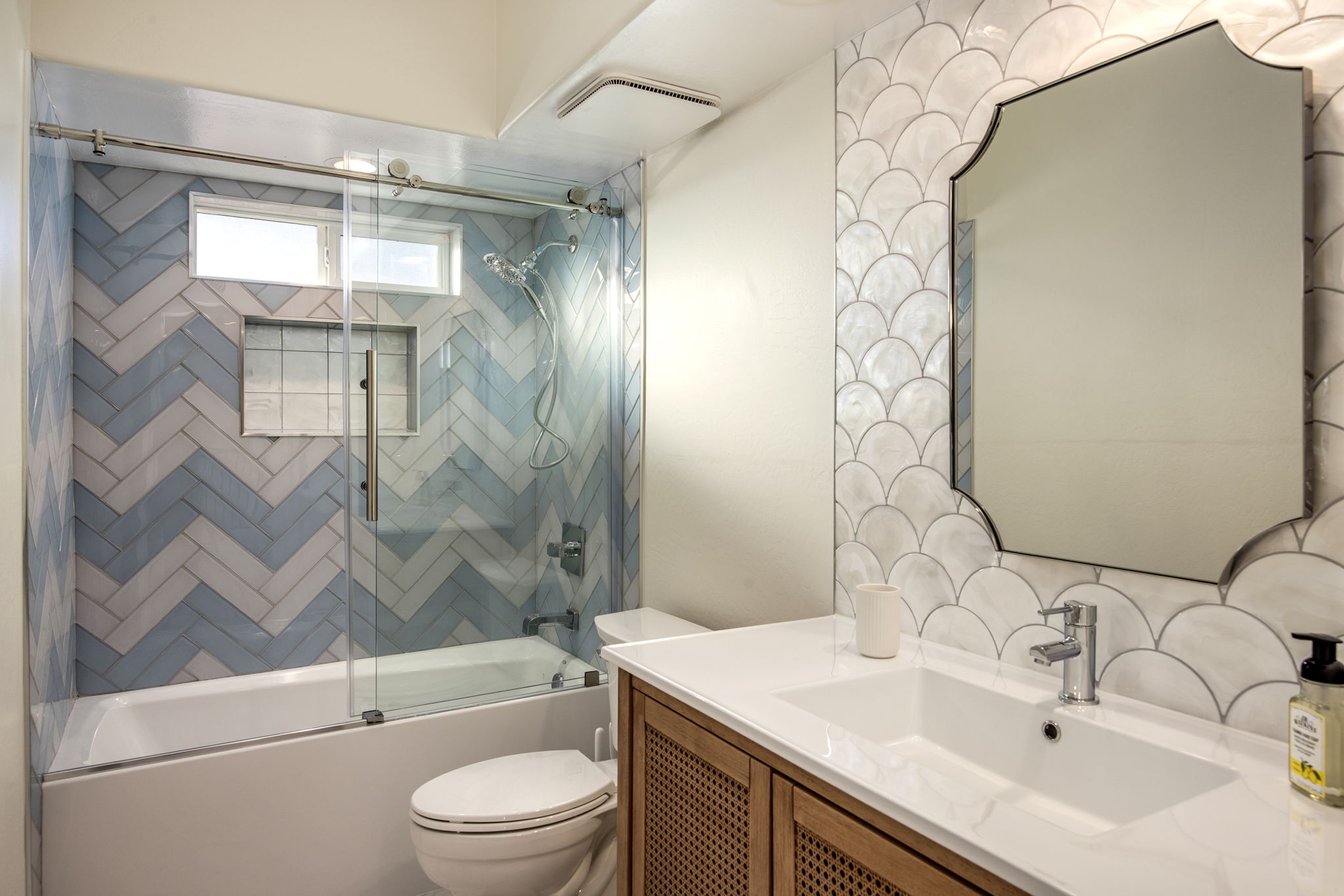 Fresh, clean crisp bathroom with step stool and soaking tub.