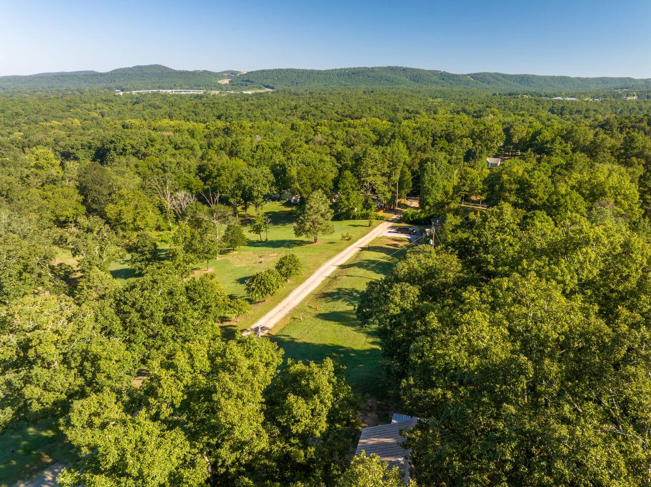 Farmhouse driveway with house in the lower right corner.  View of Hot Springs Valley and Hwy 70
