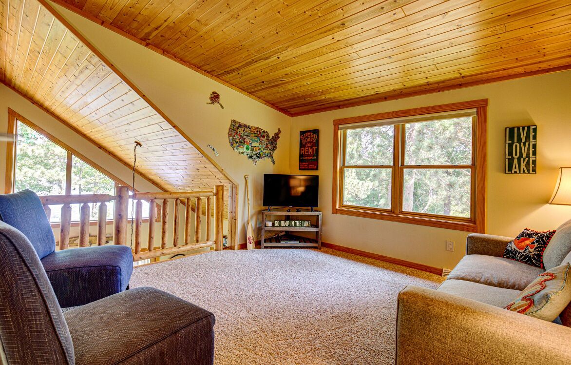 Upper level loft with pull out couch to queen bed.
