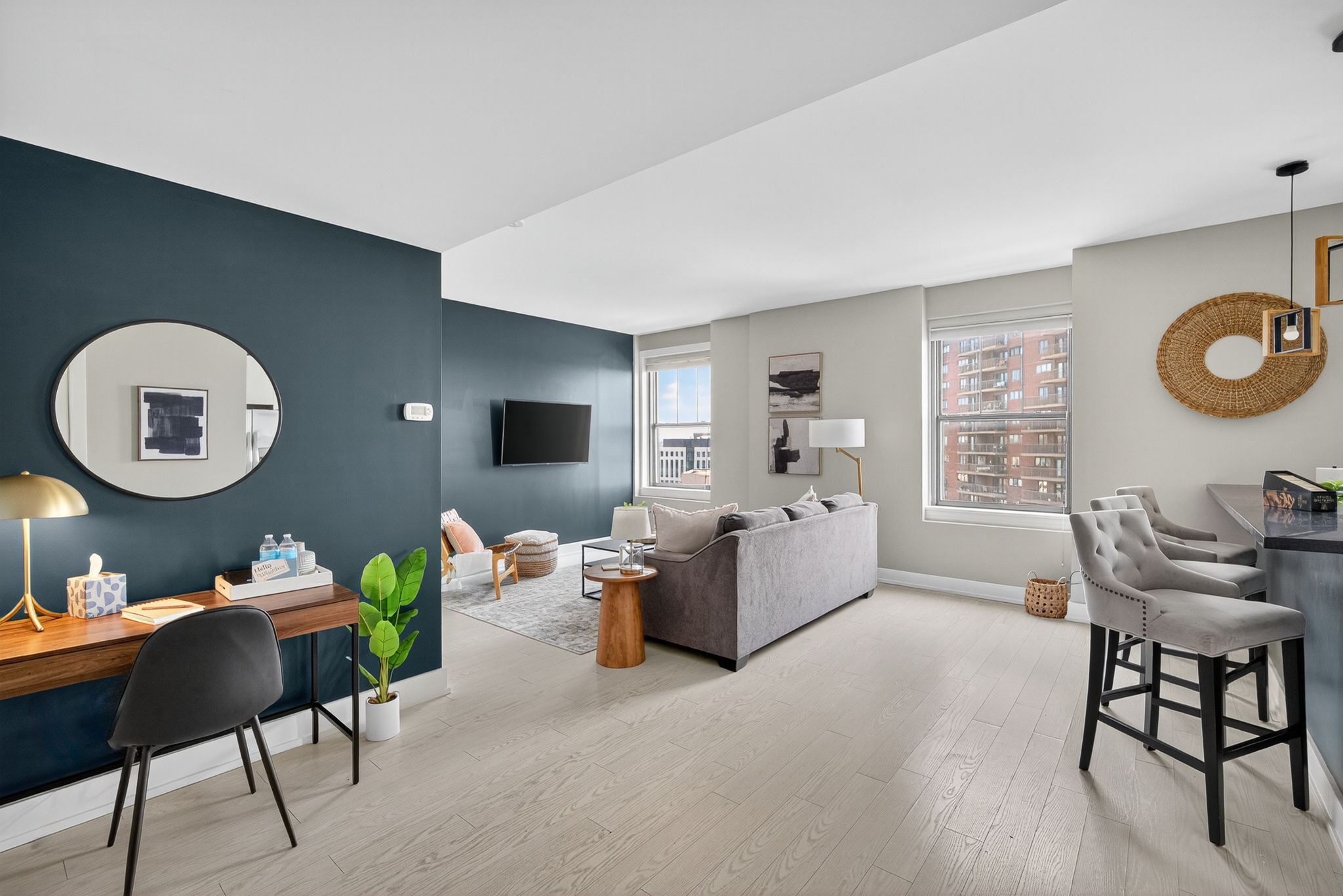 Wake up to city views in this bright, open-concept living space with a thoughtfully arranged sofa bed.