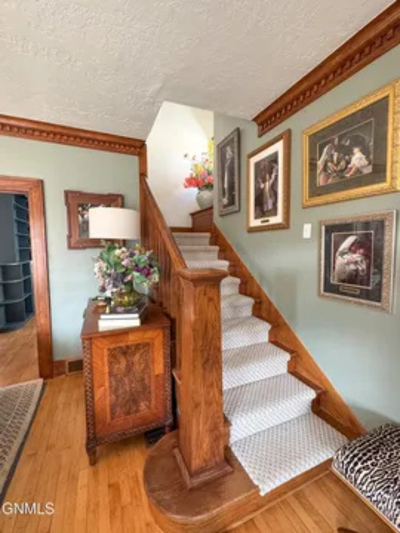 From the staircase to the wood accents, the entry has a classic and comfortable feel.