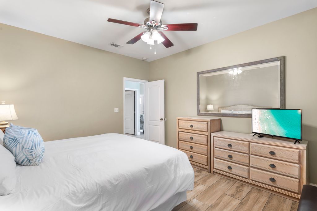 First Floor: Bedroom 1 – TV and nightstand view