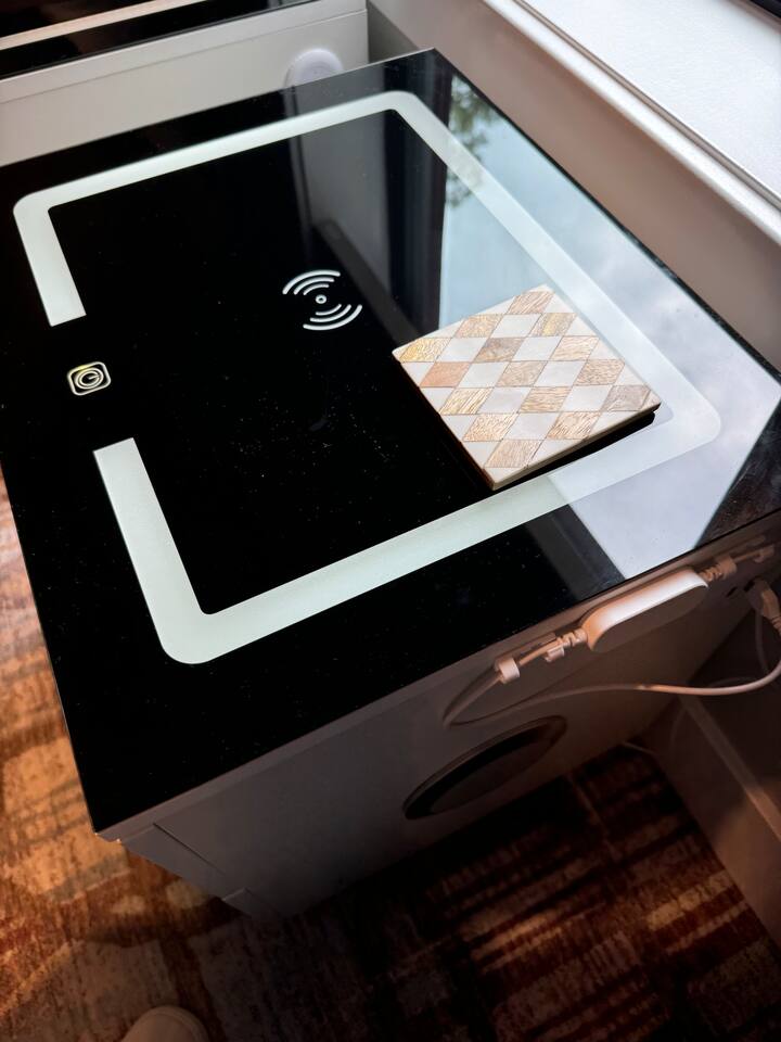 Wireless and lighted nightstands for your electronics in the twin bedroom.