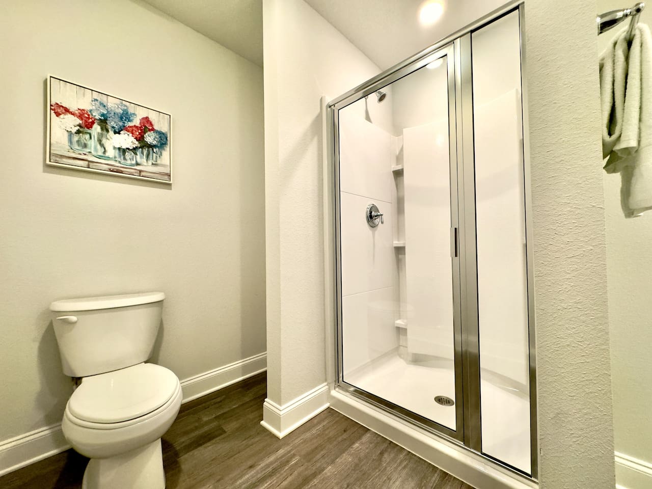 Step behind the glass, warm water rushing over you. Cool tile beneath bare feet, a soft towel waiting nearby. Steam rising, quiet and private.