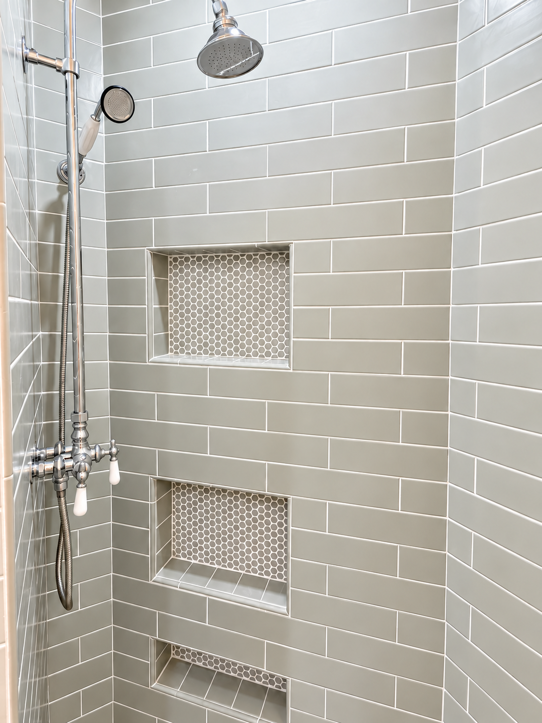 Master bathroom featuring a stylish tiled shower