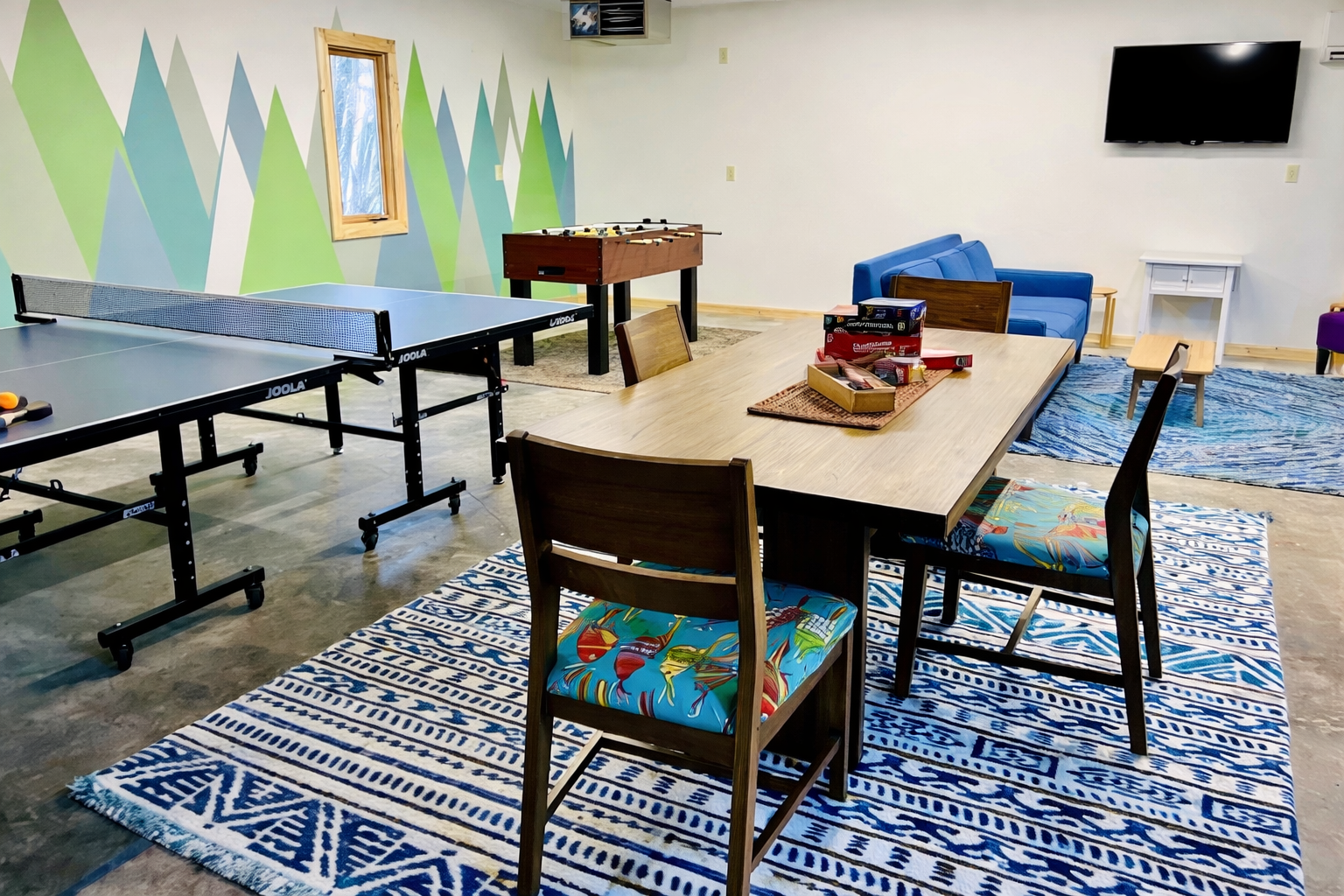 The new garage game room is perfect for unwinding after a day of adventure. Play ping pong, foosball, or a card game—fun and friendly competition for everyone!