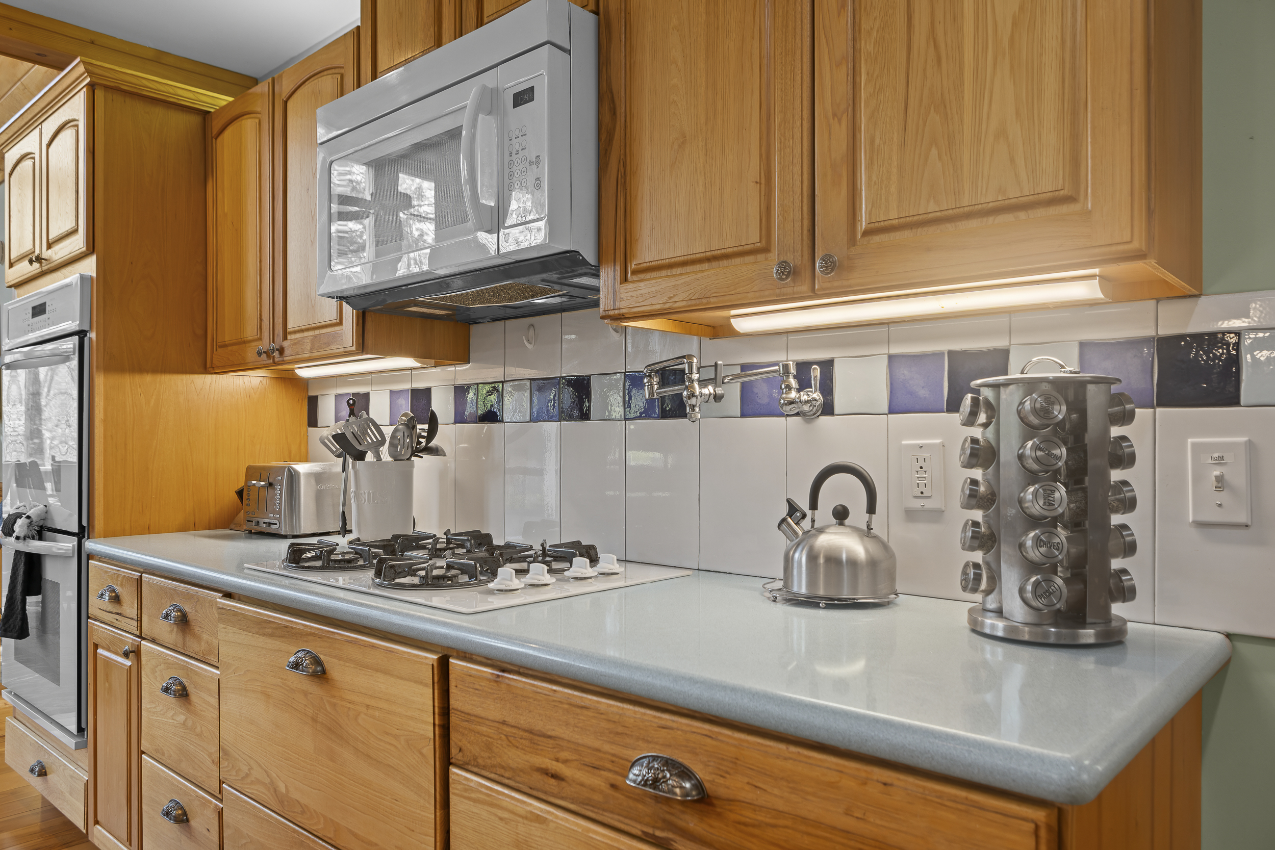 Kitchen: Cook up memories in this bright space featuring modern appliances and stylish decor!