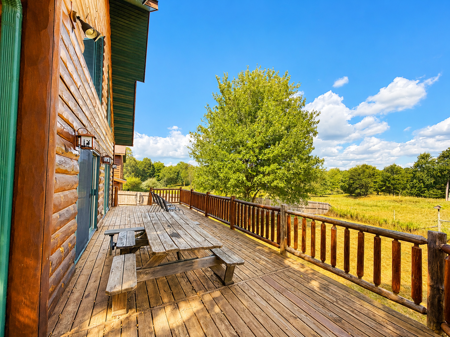 Spacious deck with picnic table seating gives your group an easy place for outdoor meals, fresh air and a spot to enjoy watching the wildlife.