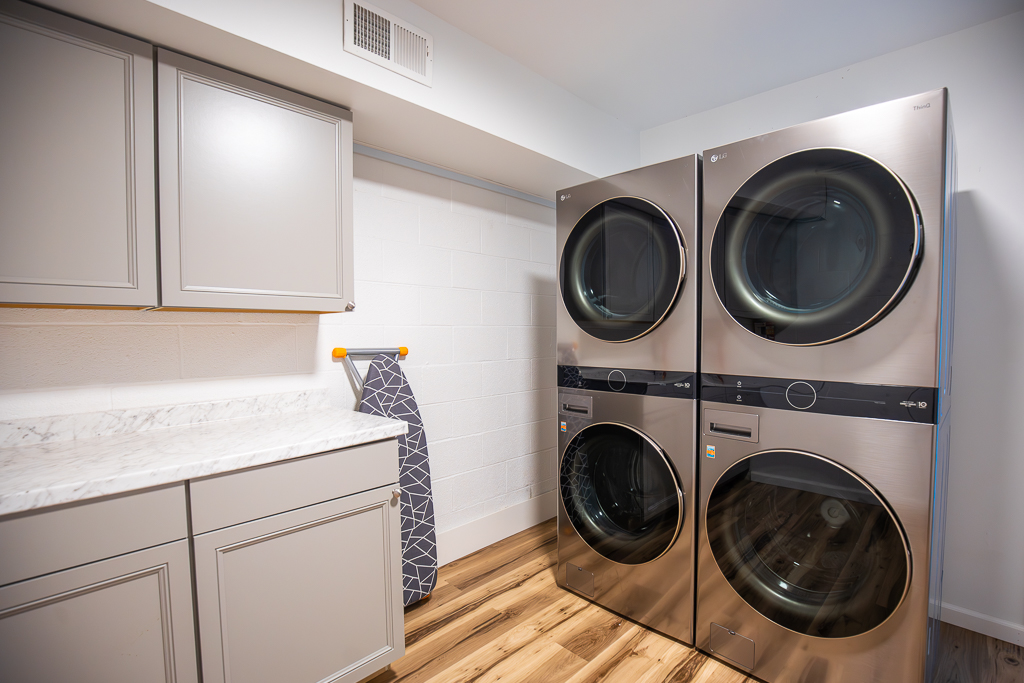 You’ll love the convenience of the laundry area with a double set of washers and dryers for your large group
