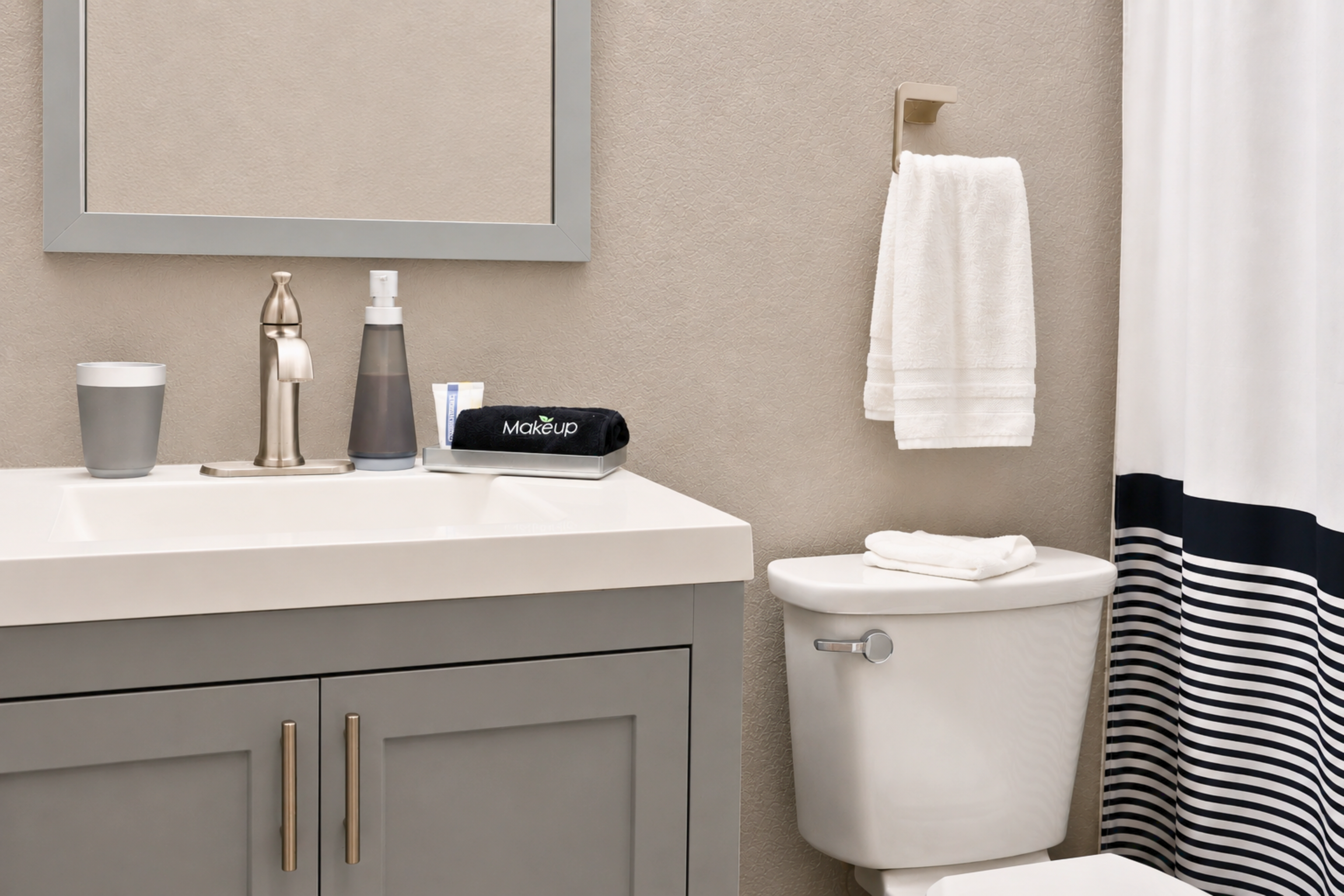 Clean and modern shared bathroom with tub/shower combo, fresh towels, and all the essentials for a comfortable stay. 