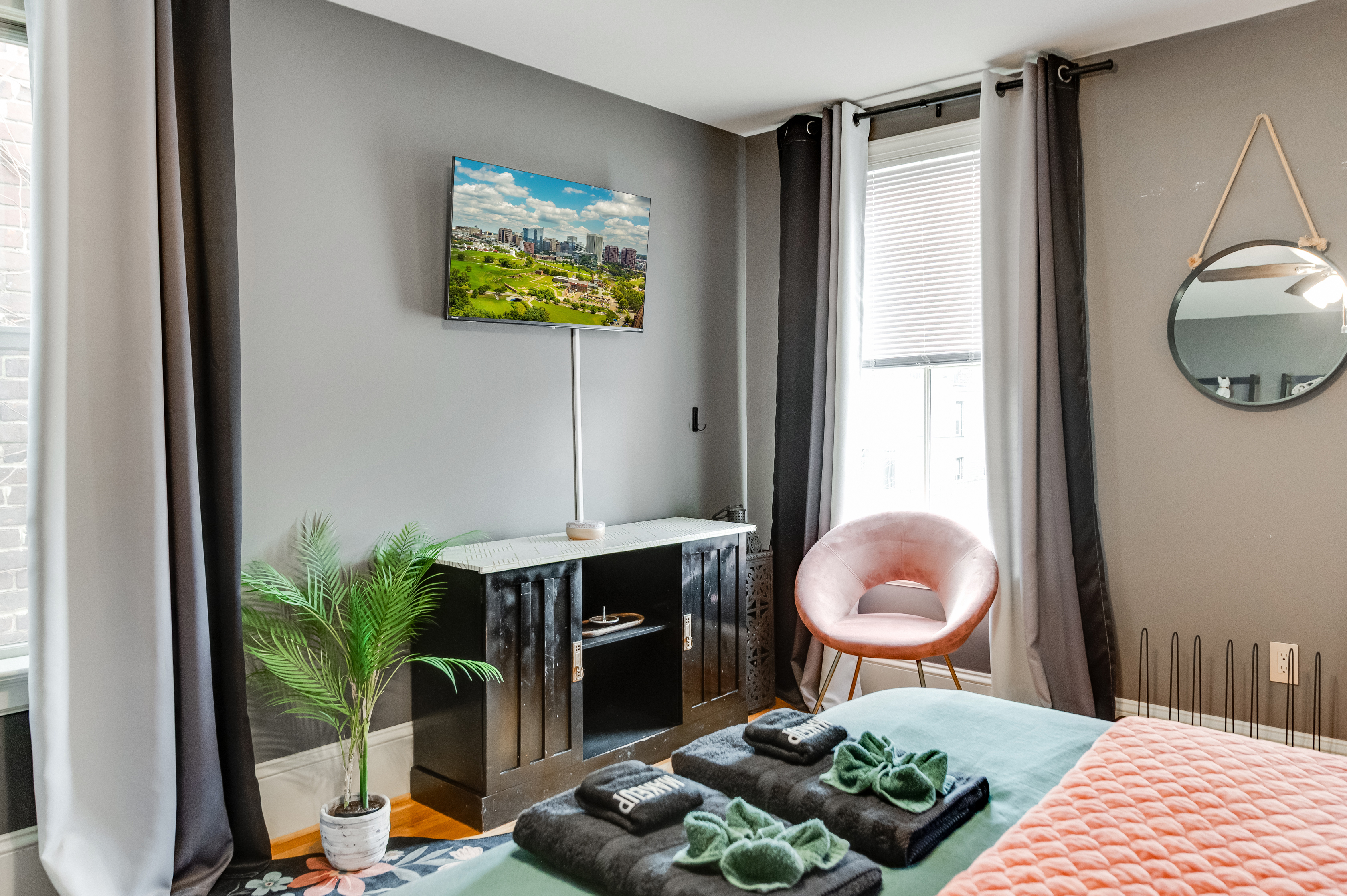 Queen Bedroom 3: Enjoy urban views, stylish decor, and comfy furnishings for your getaway!