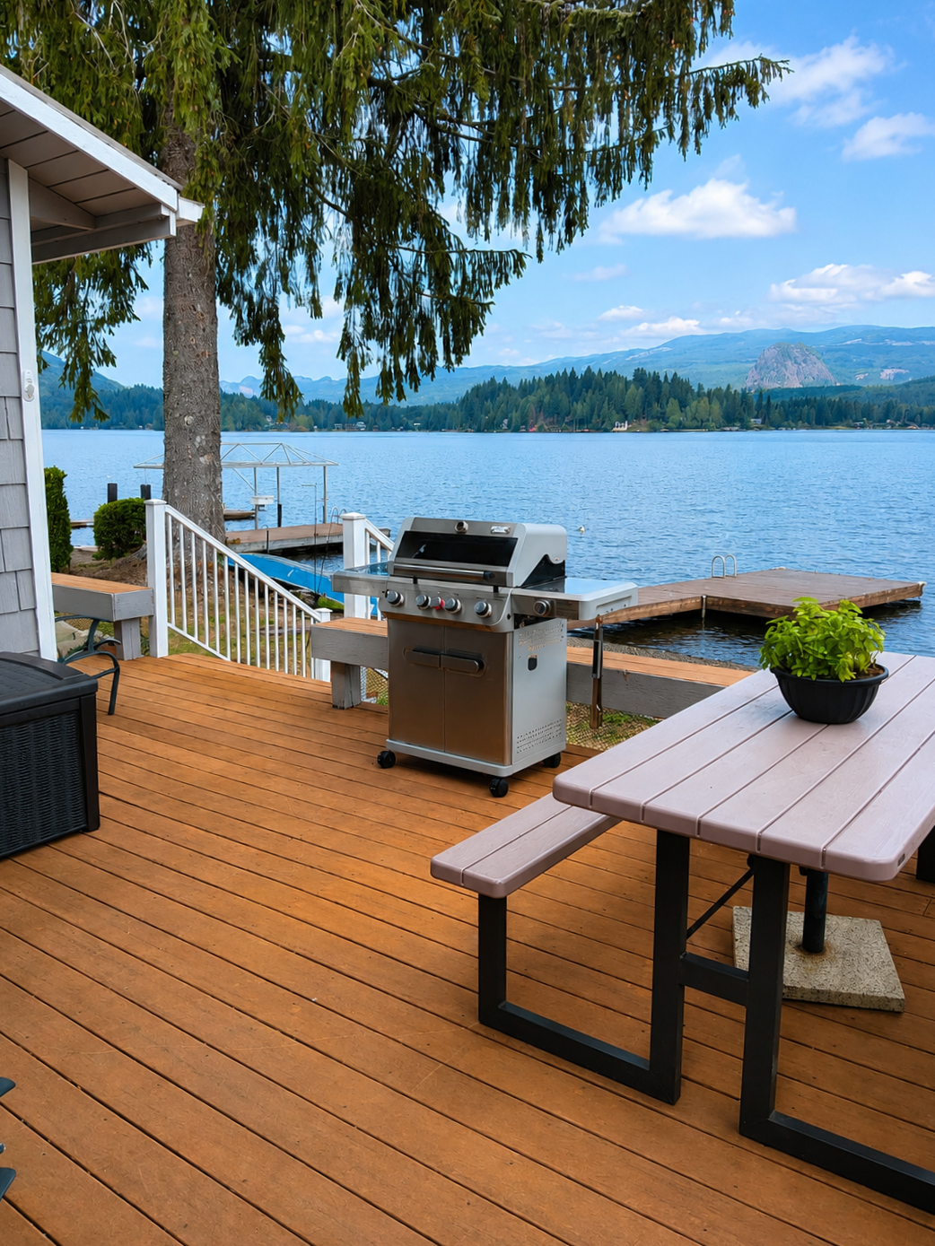 Enjoy the lake views from the deck with comfortable seating, a grill, and plenty of space for outdoor meals and relaxing.