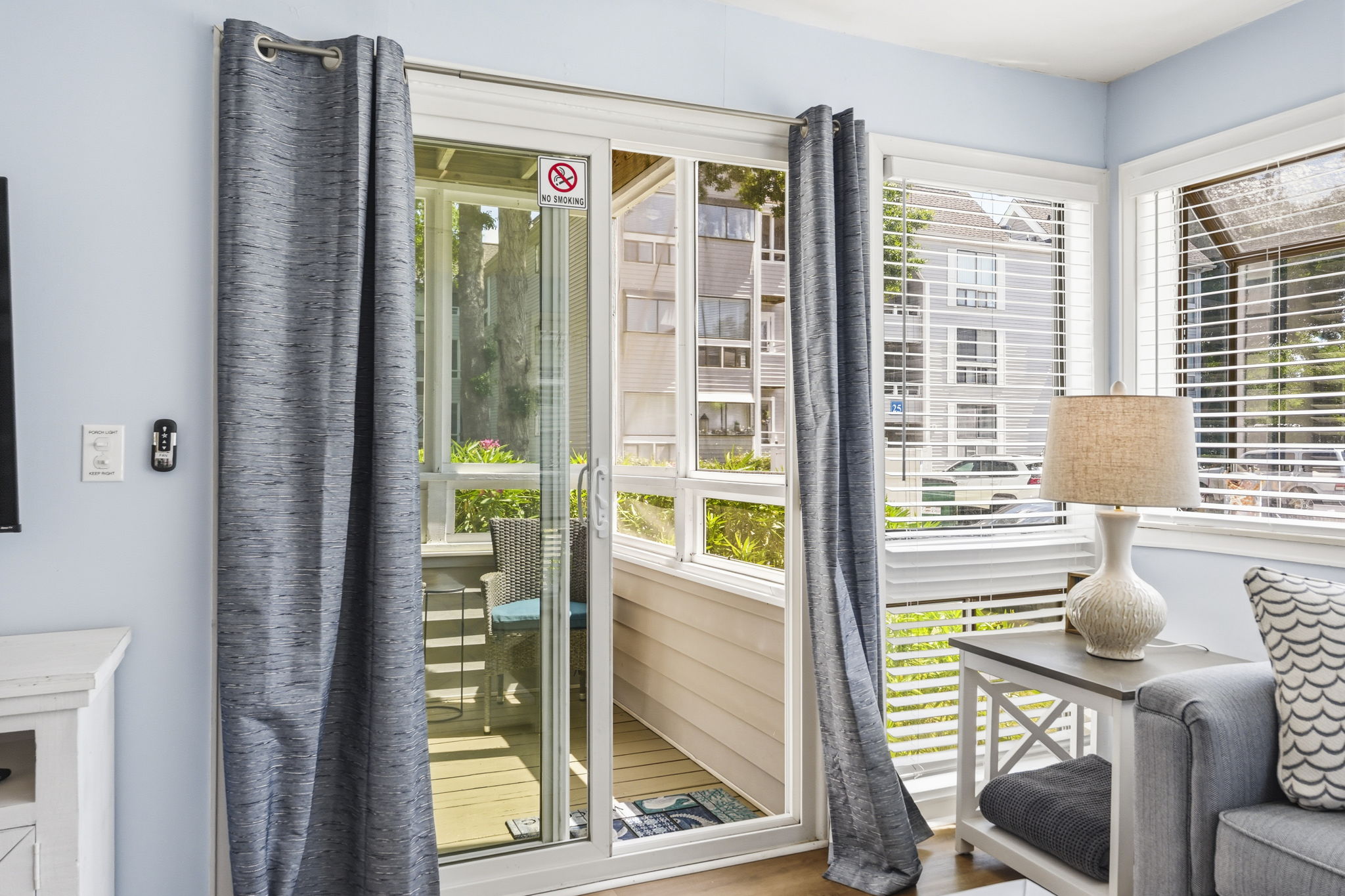 Enjoy sounds of the ocean from the glass enclosed back porch