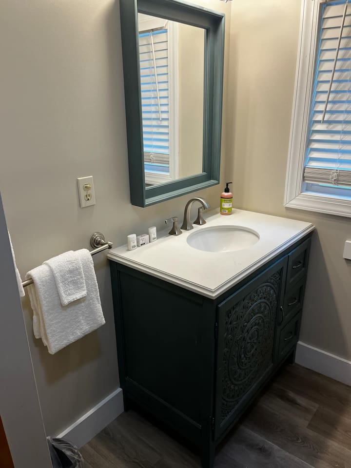 Full Bathroom located in hallway between bedroom 2 and 3